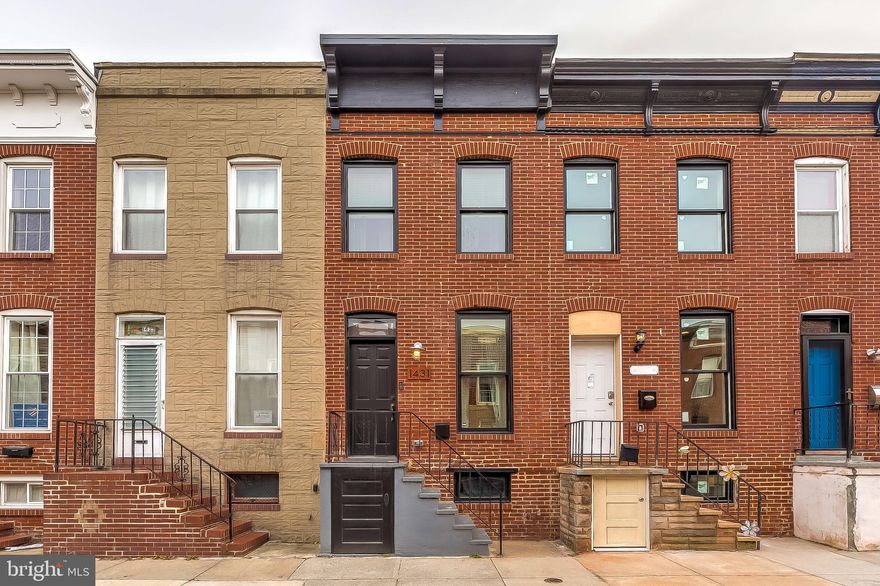 BEAUTIFULLY DESIGNED LOCUST POINT RENOVATION WITH PARKING! Hardwood floors throughout. Spacious living room with exposed brick, updated kitchen w/ quartz counters & SS appliances, and a half bath on the first level. Upper level consists of 2 Beds and 2 full baths , laundry, and a rear deck. Unfinished basement with ample storage.  This home is conveniently located near Fort McHenry and Latrobe Park. Only minutes from I-95, Federal Hill and Downtown!