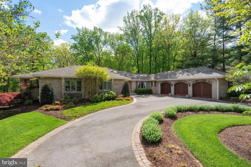 If you are looking for exceptional space and gracious public rooms, plenty of bedrooms and bathrooms, and an absolutely gorgeous sylvan setting - and still want to be within a short distance to the downtowns of Washington and Bethesda and 495, then you need to come and view this tremendous property.   A dramatic entry foyer with vaulted ceilings greets you upon entering the house.  Big public rooms abound from there, including a living room, dining room seating 12, super spacious family room with gas fireplace, and a simply fabulous kitchen with storage galore, a handsome island and smartly located breakfast area against two glass walls providing lots of light and beaufitul views of the veritable forest beyond.  A very substantial and private primary bedroom with ensuite bathroom and two walk-in closets also graces this level.  The main level also features two additional bedrooms and three additional full bathrooms, plus a powder room.  And that's not all - an office/den, mudroom and laundry room complete the main level - until one reaches either the three car garage or the large wood deck and hot tub at the rear of the property.  Heading downstairs one is greeted by a second very large foyer with kitchenette, opening to a simply massive family/game room suitable for dozens of uses.  And then there are the exercise room with floor to ceiling mirrors, the music room with ceiling accoustic tiling, two more bedrooms, two more full bathrooms and a huge amount of storage along with the utility room.   I am really only touching on the highlights of this outstanding property.  One must see it to believe how lovely and spacious this offering truly is.  Open house Sunday, 4/28 from 2-4 pm.   Please come on by!