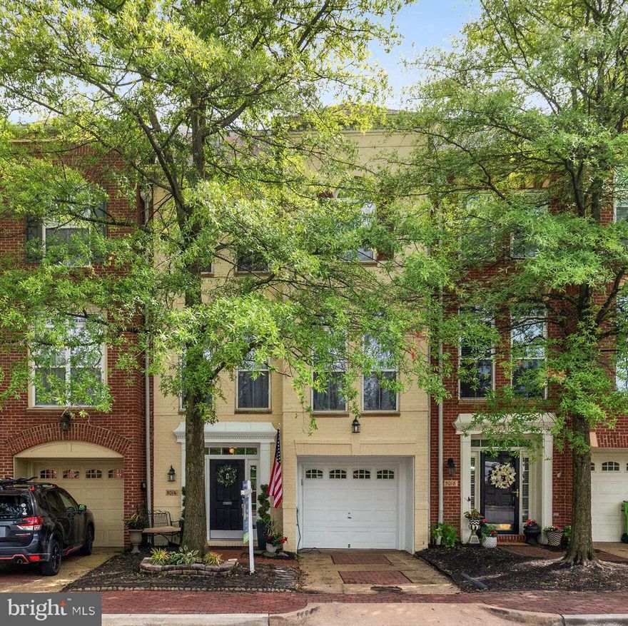 Welcome to this beautifully updated and impeccably maintained James Blair model, offering full bump-outs on every level for exceptional living space and versatile functionality. From top to bottom, this home has been thoughtfully enhanced with modern upgrades and timeless finishes. The inviting lower level features hardwood floors, fresh paint, and updated lighting—completed in 2025. A cozy family room with a 60" remote-controlled electric fireplace with mantel, a 120” projection screen with projector and sound bar with surround sound (both convey) creates the perfect space for movie nights or game days. A full bathroom with a walk-in shower adds convenience, while barn doors enclose the rear bump-out, ideal for a private office or den, guest room, or fitness space. Step outside to the fenced-in patio with new hardscape—an ideal setting for outdoor entertaining or quiet relaxation. Upstairs, the main level boasts an open-concept design filled with natural light. The chef’s kitchen features granite countertops, stainless steel appliances, a gas cooktop with downdraft, dishwasher, and a charming gas fireplace. Elegant cabinetry with brass hardware, a marble backsplash, and a built-in coffee station with wine fridge complete the stylish and functional kitchen. The adjacent family room flows seamlessly onto a private deck, perfect for grilling, morning coffee, or unwinding after a long day. On the upper level, you’ll find three generously sized bedrooms with new carpeting, including a luxurious primary suite with vaulted ceilings and a newly renovated spa-like bath with a corner soaking tub and separate shower. Two additional bedrooms share a well-appointed hall bathroom. Major updates include a professionally serviced roof, freshly painted front exterior and fence, new furnace (2025), newly installed light fixtures and recessed lighting throughout, new smoke detectors, fresh interior paint, and updated kitchen and baths. Complete with a one-car garage and full driveway, this home offers comfort, style, and convenience in one perfect package. Ideally located just minutes from all Cameron Station amenities and the green spaces of Brenman Park, this exceptional property is not to be missed.