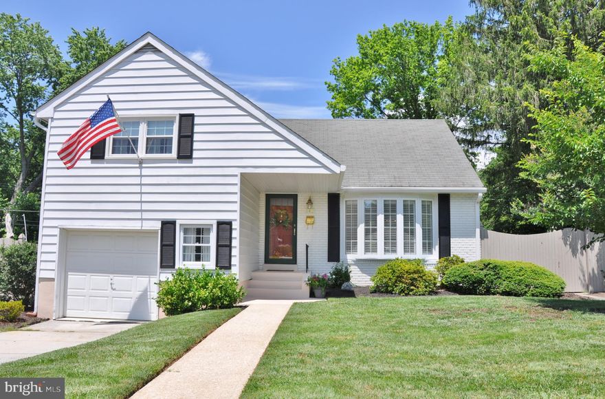 Amazing updated split-level home on a lovely landscaped, fenced lot with a great deck overlooking Orchard Park.  Three and a half finished levels with a garage too!  Inside beautiful views from sun-filled, inviting great room with gas fireplace.  Gorgeous hardwood floors in the living room and dining room, updated kitchen with granite counter-tops, three full beautiful bathrooms, and a large addition off the back that has vaulted ceilings, gas fireplace and sliders out to the deck and backyard.  The lower level is finished with built in bookcases.  Also, in the lower level is a utility room and a small workshop area.  Freshly painted with tasteful neutral colors throughout this home.  The rear yard has a privacy fence, nice landscaping, a patio, deck and a shed.  Please see associated documentation for all upgrades and special features.  All appliances convey with property and a home warranty too!  Check out all the pictures and call with any questions.  Set up your private showing today or come to the open house.Located on a quiet street, great for commuting to Towson, Hunt Valley and Baltimore.