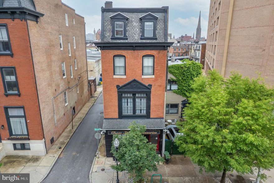 Here's an opportunity that will give you the best of both worlds, where you can occupy the top 3 levels, secure an income from the entry level (Commercial Space) or simply restore it to it's former state of a  bed 1 bath. Located in the Historical Mt. Vernon area this property was renovated a few years ago, but still possesses some it's original charm  of wood floors, fire places, windows, french doors, 12' ceiling with crown mouldings, spiral staircases and the list goes on. The entry level gives access to the commercial area and private entrance to the 2nd level where you'll find an awesome living/sitting area, a half bath, dining area and a kitchen befitting for the chef in your family. You can choose to eat in or take the entertainment outdoors on the deck with family and friends the option is yours. The 3rd level boosts a huge awesome master bedroom, full bath and a room hosting a hot tub, sauna and a custom walk-in closet.  There's still more, as the 4th level is home to 2 bedrooms, a full bath, laundry and all the storage you'll need. Parking is to the back however, there's additional secure parking across the road in the garage for a minimal fee. Restaurants, grocery store, gym, thrift boutique, cafe entertainment is at your fingertips for your convenience.  This property is well secured with a reliable security system with 9 cameras (no monthly subscription), topped with an intercom system, keyless entry and many more features just for you. Welcome Home!