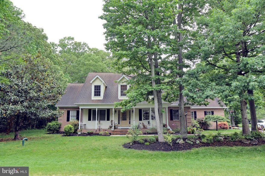 PRICE REDUCTION!! **Sellers found home of choice** Beautiful home boasts two master bedrooms, first floor master in addition to  second floor master suite, guest room and den/office, pellet stove in great room, newly refinished hardwood floors,gourmet kitchen with granite counter tops, screened porch, private back yard and you must check out the additional living area/man cave in the garage!