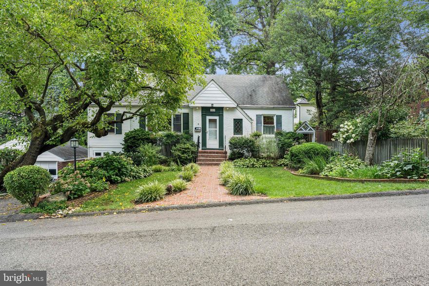 Beautiful white brick home set on a quiet street surrounded by meticulous and lush landscaping. Driveway parking for two cars and an attached garage, as well as an elegant brick walkway leading to the inviting front stoop. Foyer entry provides sight lines into the formal living room anchored around a fireplace and views into the expanded dining room. Chef’s kitchen is adjacent to the dining room and looks out over the backyard through the screened-in back porch. Kitchen features stainless steel appliances, granite countertops, abundant wood cabinetry and a food pantry. Main level also includes two spacious bedrooms that share a hall bathroom. Main level office provides easy work from home capability. Upper level features a generous owner’s suite, complete with large bedroom including a sitting area, a full bathroom and a bedroom that has been converted into a closet and dressing room including custom built-in cabinetry and storage solutions. Lower level includes an alternate fourth bedroom and abundant unfinished utility/ storage space, ideal for a workshop, with access to the attached one car garage. Tranquil fully fenced backyard has access to the wonderful screened-in porch and is surrounded by mature trees for abundant privacy. Meticulously cared for by longtime owners, freshly painted and entirely move-in ready, this is one not to miss! Waverly Hills neighborhood is centrally located, super convenient to Ballston, easy access to Lee Heights Shopping Center, and in the Glebe, Dorothy Hamm and Washington-Liberty school pyramid!