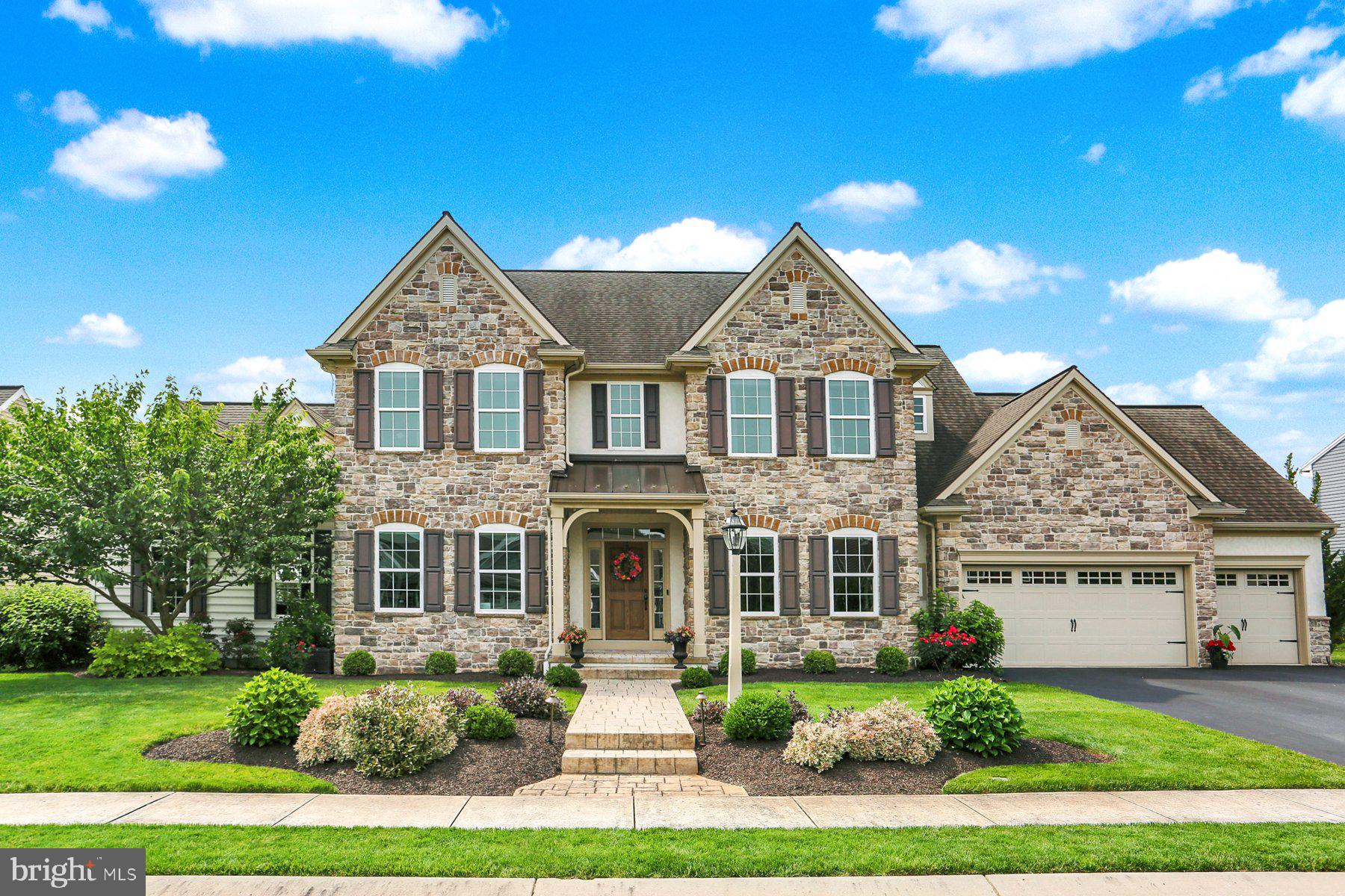 Welcome to this exquisite estate home in the sought-after Orchard Glen community, where luxury, functionality, and stunning outdoor living come together seamlessly. Step inside to an open floor plan showcasing a gleaming white kitchen with granite countertops, tile backsplash, a spacious island with seating, walk-in pantry, and eat-in dining area. The elegant formal dining room is accented with custom trim and a beautiful stone feature wall. A private office or playroom with French doors offers versatility, while the expansive step-down vaulted family room provides an inviting space to gather. The owner’s suite is a true retreat with a dramatic stone accent wall, dual walk-in closets, and spa-like ensuite. Additional bedrooms include one with a private bath and two sharing a convenient Jack & Jill bath. The finished lower level adds incredible living space with a stylish half bath. Outdoor living shines with panoramic views of the mountains and Ski Roundtop, a 24x38 saltwater pool with full automation, heat, and automatic safety cover, plus a custom outdoor kitchen and expansive patio—perfect for entertaining or relaxing in your own backyard oasis. 3-car garage. Superior upgrades throughout. Every detail has been thoughtfully designed to impress—you truly will be blown away. Schedule your private tour today!