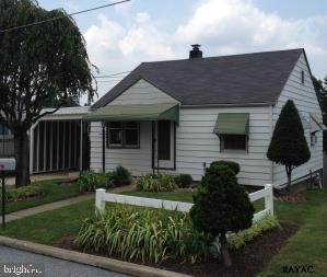 Cozy 2 bedroom 1 bath cottage in great condition! Hardwood floors throughout, kitchen with stove, refrigerator and dishwasher. Washer/dryer (courtesy only), large fenced in back yard, carport and finished basement. Small dog negotiable with deposit. Tenant responsible for lawn care and snow removal.