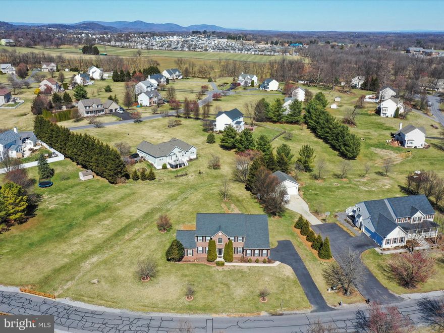 In the highly desirable Harlan Run only 5 - 6 Mins from I-81. Close yet the 1.03 Acre property feels relaxing & peaceful. Hedgesville School District  


 The septic has been pumped and passed all inspections as well as a radon mitigation fan installed. Flohr Pools has came out and said they can install an inground pool.

Over 5,000 Sqft 4 bedroom, 3.5 bath Sequoia model, colonial home including a HUGE almost 1,500 sqft fully finished basement already wired and plumbed for an In - Law suite or separate apartment that has the potential use of 3 additional bedrooms and 1 full bath. 

5 Year old roof, one of the Hvac units is only 4 years old. 

A Luxury Primary suite awaits you with tall ceilings arched from 9 - 15 ft. A separate sitting area leading to a balcony where you can leave the door open and let the fresh air just flow throw. The closet in this suite is probably one of the largest closets you've ever seen which leads to the en suite bath featuring a soaking tub, separate shower and double vanity sinks. The upper level features 3 more bedrooms (2) connect to a Jack and Jill bathroom. A stroll down to the main level has many spacious rooms including a Office / Den or could be used as a main level bedroom next to a 1/2 bath.  

Kitchen has 42' cabinets, 4 burner cooktop with a griddle, 2 wall ovens, under the granite counter sink, Island, desk / workspace all openly shared with the living room with lots of natural light from the tall windows throughout.   w/additional great room addition
Check
This model is nothing short of impressive w/ a great room addition & over 3K chandelier. You need to see to appreciate and add your final home(y) touches.