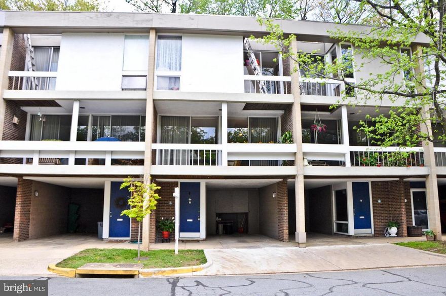 This Charles Goodman Mid Century modern townhome is where you can experience living with walls of glass bringing the outdoors in and enjoy the beautiful views and lush landscaping surrounding the Hickory Cluster of 90 international styled townhomes located just across from Lake Anne. This architect used modern concepts of vertical wood accent walls, open tread staircases and an open floor plan where you can enjoy the view from the front balcony or the privacy of the back patio anywhere on the main level. The kitchen has been updated and has stainless steel appliances. The upper level boasts a renovated bath with ample storage, a lovely primary bedroom with a wall of closets, the secondary and third bedroom both with access to the upper level balcony. Lower level boasts the laundry room with an extra storage area potential for office or rec room. This space is somewhat finished and not included in the listed sqft. There is a bonus 2nd shower stall that's great when coming back from the pool. Also on lower level is a half bath and the main entrance from the carport. Bring the ELECTRIC VEHICLE! This home has been well maintained, new  roof in 2020. Water heater is newer as well. Enjoy all the amenities of the Reston Association plus the close proximity of this property to the Lake Anne Village Center, Pools, Reston Town Center, trails and other recreational amenities. Air conditioning is through RELAC. These highly desired models aren't available often.. Owner agent