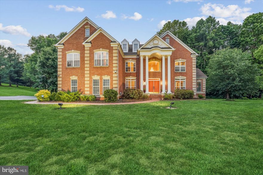 Welcome to this exceptional 8,334 sq ft custom home, thoughtfully designed and meticulously maintained by its original owners. Nestled on 2.4 acres of beautifully balanced lawn and mature trees, many planted by these owners, this residence offers luxury, comfort, and privacy in equal measure.
Upstairs, each of the four spacious bedrooms boasts its own en-suite bath and walk-in closet, including a lavish primary suite featuring a custom dressing room and two newly remodeled walk-in closets. "The spa-like primary bath is both expansive and calming, designed to make morning and evening routines feel effortless.   The bedroom is grand and allows for relaxation, featuring a double-sided gas fireplace that separates the sitting area from the rest of the room. 
The main level invites you to relax and entertain with ease, featuring a welcoming living room, a private study, and a holiday-sized dining room perfect for special gatherings. The heart of the home is a unique and expansive kitchen, featuring generous cabinetry, dual pantries (including a walk-in), an oversized island with seating, and a sunny breakfast area that seamlessly flows into the family room. Here, walls of windows and “smart” shades illuminate stunning tigerwood floors, complemented by a cozy gas fireplace and ceiling fans.
A glorious sunroom offers peaceful views of the lush grounds, while the large deck—with romantic post and stair lighting—sets the stage for outdoor entertaining. The fully finished walkout basement adds a bedroom, full bath, and game room.
Additional highlights include front and rear staircases, a 3-car attached garage plus a 3-car detached garage, solar driveway lighting, extensive parking, and designer lighting at the exterior front.
The sellers have spared no effort in updating and lovingly maintaining this beautiful home. This home has undergone the following improvements: Roof, gutters, and gutter guards (2020), A/C compressor (2022), Gas Furnace (2022), main house garage doors (2022), Hardwood Floors (2017-2024), and Solar Drive lighting (2025).   Be sure to click on the virtual tour icon for the interactive floor plan, and contact your Realtor today to schedule your private tour.  Aerial overview is in the documents.