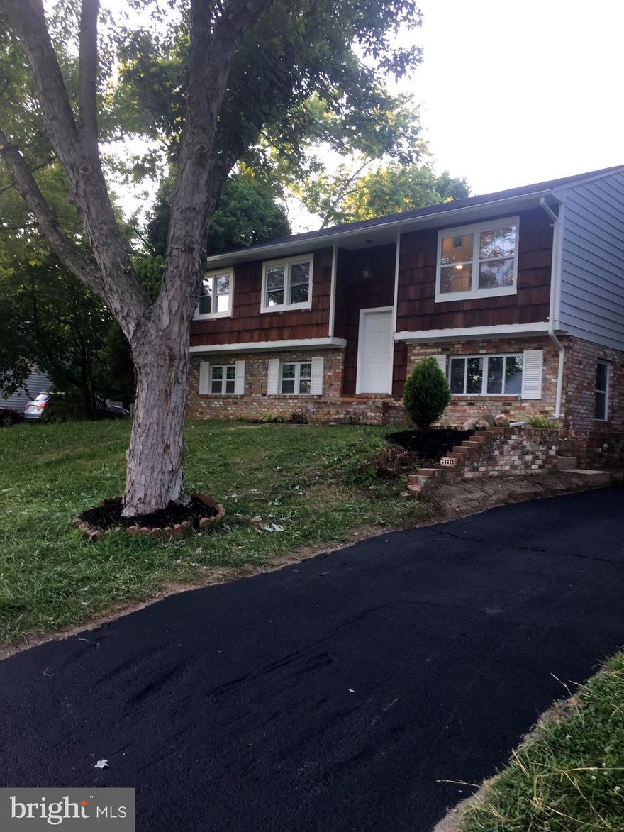 WELCOME HOME ! 5 BEDROOM 3 FULL BATH FULLY RENOVATED AND REMODELED TO INCLUDE ***,SOFFITS***, HVAC SYSTEM***,STAINLESS STEEL APPLIANCES***, FIXTURES***, INCREDIBLE FIREPLACE***RENOVATED BATHS WITH TILE***, REHABBED DECK,*** NEW PAINT AND FLOORING,*** FRONT LOADING WASHER AND DRYER**, NEW DOORS,*** OFFERS LARGE LIVING AREA AND RECREATION ROOM,  LARGE DRIVE WAY AND YARD *** A TRUE 10++++++