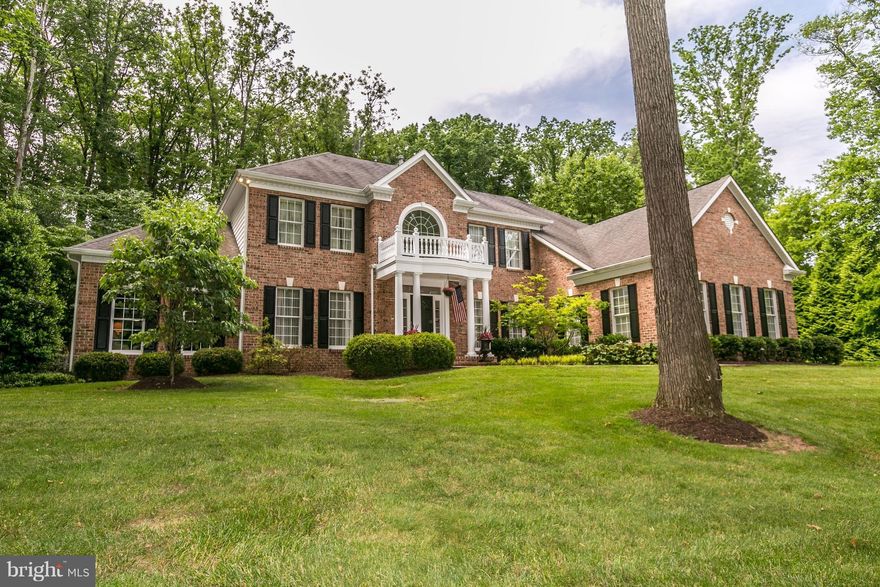 Immaculate custom home w/finest finishes.Expansive attached family/breakfast room/gourmet kitchen w/granite,new backsplash, SS Appliances, new coffered ceiling. Separate dining/lounge and large sunroom. Luxury master suite w/tray ceilings,WIC's, separate tub/walk in shower.Fully finished lower level w/custom bar area,guest bed/full bath, exercise room.Exquisite hardscaped private yard/patio area.