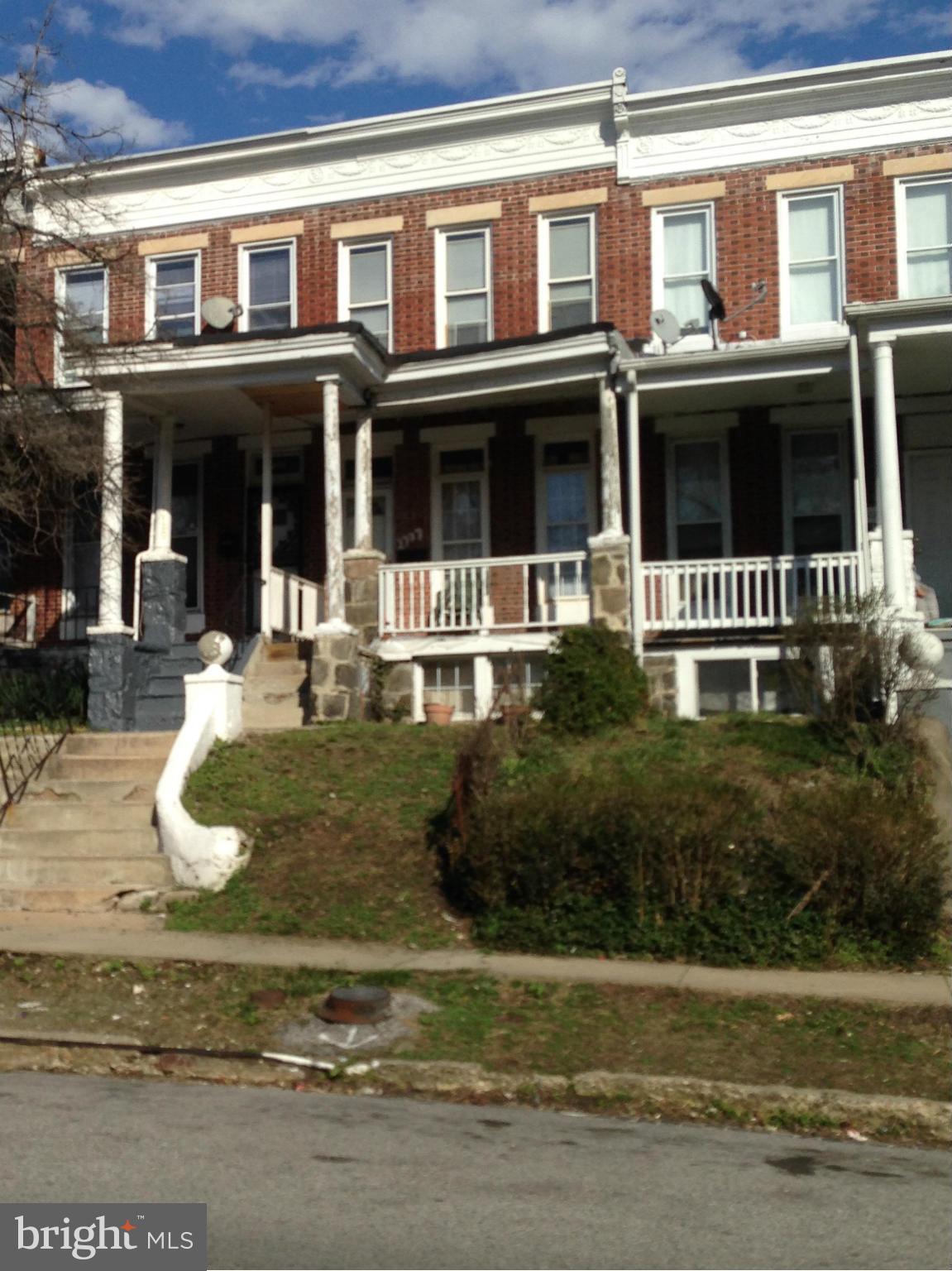 TENANT Occupied, and tenant PAYS $200 WEEKLY! NEW ROOF!! ENTERTAINER'S DELIGHT! Elegant Columns, Gleaming, Hardwd flrs. LARGE, FRONT PORCH. HUGE, OPEN LAYOUT Liv Rm & Din Rm. LARGE Kitch. LOTS of Cabinets & Countertops. 3 SPACIOUS BRs. SKYLIGHT! ENORMOUS BASEMENT. BACKYARD. Sold AS-IS. Seller will do no repairs. Near Coppin State University. CASH OFFER ONLY.