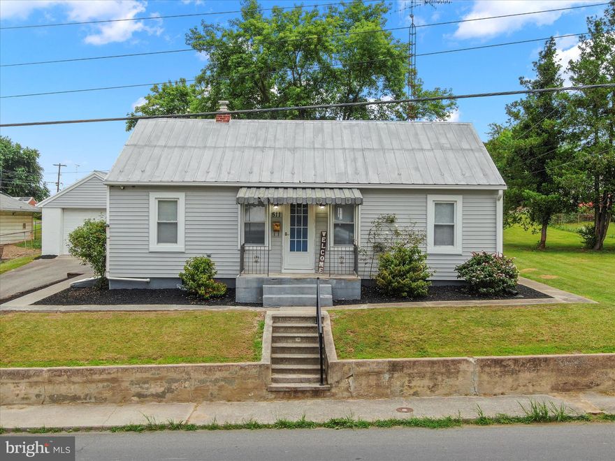 This charming ranch-style home offers a perfect blend of comfort and functionality. Built in 1950, this well-maintained residence features a spacious layout with 768 square feet of finished living space, ideal for creating lasting memories. As you step inside, you'll be greeted by a warm and inviting atmosphere. The interior boasts three cozy bedrooms, each designed to provide a restful retreat. The full bathroom is conveniently located, ensuring ease of access for all. The heart of the home is the well-equipped kitchen, complete with essential appliances including a dishwasher, electric oven/range, refrigerator, and washer/dryer. The full, unfinished basement offers endless possibilities for customization, whether you envision a recreation room, workshop, or additional storage space. The detached garage provides convenient parking, while the paved driveway ensures easy access. Set on a generous 0.46-acre lot, the outdoor space is perfect for gardening, play, or simply enjoying the fresh air. The property is surrounded by a peaceful neighborhood, providing a sense of community while still being close to local amenities. Located just a short drive from shopping centers, parks, and dining options, this home offers the perfect balance of tranquility and convenience. With its inviting interior, functional layout, and prime location, it's ready to welcome you home. Don't miss the opportunity to make this charming residence your own!