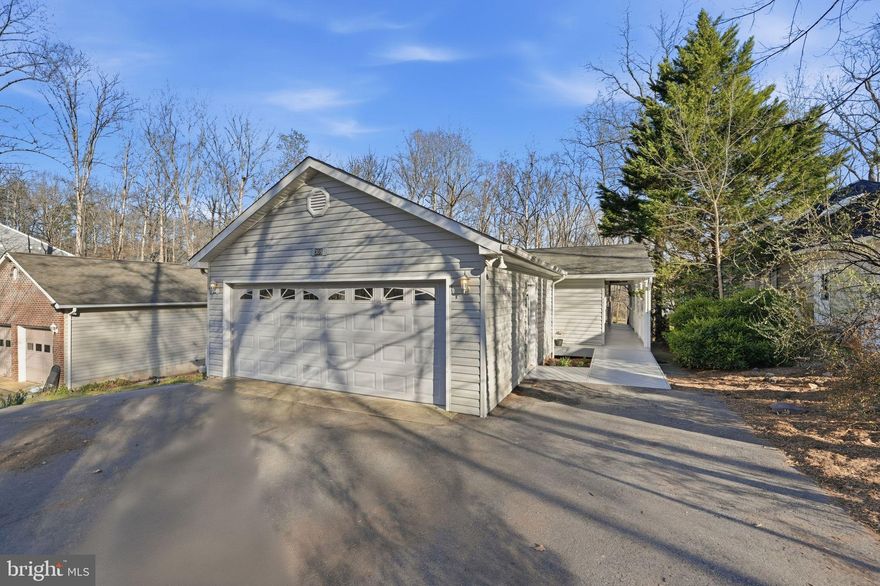 WATERFRONT LIVING on Lake Keaton in the amenity-rich, gated community of Lake of the Woods! This well-maintained 4 bedroom, 3 bath rambler with finished basement offers the perfect blend of comfort, flexibility, and scenic lake views—ideal as a full-time residence or a relaxing weekend retreat. Launch your kayak right from your backyard and enjoy peaceful mornings on the water.
Inside, the main level offers easy one-level living with hardwood floors welcoming you into the formal living room, which flows into a versatile sitting room, den, or office space. The open kitchen features Corian countertops, all appliances, abundant cabinetry, and a breakfast bar overlooking the dining area highlighted by a cozy gas fireplace.
The impressive 23x14 sunroom with vaulted ceilings and a wall of sliding glass doors fills the home with natural light and opens to an oversized deck—perfect for entertaining, cookouts, or simply relaxing while enjoying the tranquil waterfront views.
The spacious primary suite includes a private bath with jetted soaking tub and separate shower, while two additional guest bedrooms complete the main level.
The finished lower level expands the living space with a large recreation room featuring a wood-burning fireplace and wet bar, plus direct access to a covered patio/screened in porch  and your private waterfront with bulkhead and boat launch area. A large finished basement bedroom suite offers great potential for guests, extended family, or an in-law/au pair space. A separate hobby, craft, or exercise room could also serve as a 5th bedroom (NTC). Additional unfinished areas provide excellent storage or room for future expansion.
Situated on a paved driveway with an attached two-car garage, this home invites you to start making lake-living memories.
All new HVAC in 2022.
Lake of the Woods is one of Virginia’s premier gated lake communities, offering two lakes (including the 500+ acre main lake), boating, fishing, beaches, marinas, golf course, clubhouse dining, sports bar, fitness center, swimming pools, pickleball and tennis courts, equestrian center, walking trails, and year-round community events. Conveniently located approximately 15 miles west of Fredericksburg with easy access to shopping, dining, and commuter routes.
Come discover why so many people love living the Lake of the Woods lifestyle.
Seller to give purchaser a $5,000 carpet allowance with acceptable offer.  Also, there is extra laminate flooring that seller will leave for buyer.