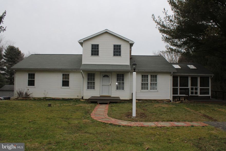 ADORABLE - 4 Bedroom, 2-1/2 Bath house for rent located on 1 ACRE property. Living room w/propane fireplace, spacious kitchen & dining, family room w/cathedral ceiling. 3 Bedrooms, 2 Baths on main floor, 4th Bedroom/office/loft on 2nd floor. Laundry room & half bath in lower level. Propane heat & central air. Landlord will provide lawn care. Available March 15th.