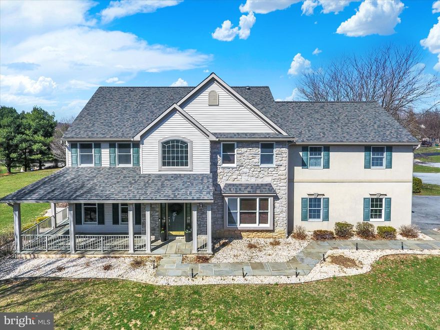 Truly unique in style and space. The inviting 2-Story entrance featuring rich hardwood floors, sets the tone for the multiple living spaces and a thoughtfully designed layout, perfect for  everyday living and effortless entertaining.  The well-appointed kitchen is a chefs dream and boasts a large granite island, gas range and custom wooden cabinets.  Serving as the heart of the home, the kitchen overlooks a large dining area, the great room area and the game day room that's equipped with a wet bar and numerous TV's for your enjoyment and relaxation.  Upstairs you will find an expansive owners suite with space for a reading nook or desk,  an upgraded tile shower with high end finishes, and a large spa-like tub.  Three more bedrooms and bath complete this area and overlooks the open foyer.
There is also a huge bonus room with a full bath and a private entrance .  Once used as an art studio, this area  is perfect for the in-laws , as guest accommodations or can be used as a comfortable retreat space. The lower level is also finished with a game room, and additional flex room for a gym or hobbies, and offers an outside entrance.  The exterior is enhanced with a beautiful hardscape setting, complete with a firepit, and pavilion --creating the perfect space to relax and unwind.   Additional mentions include a NEW roof,  gas generator, new gutters and an electric vehicle outlet.  The location is key -- close to Hershey Medical Center, Rts 322, 72, and the PA Turnpike.   Call today for more details and for a private showing.