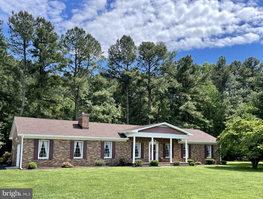 Rare opportunity to enjoy the best of town and country living in this lovingly cared-for home.  Curb appeal galore!  House sits on .92 acre corner lot just outside city limits.  Spacious home faces Magnolia-lined city park providing many beautiful and peaceful moments.  4Bedroom, 2 and 1/2 baths, with 2,332 square feet of living space plus an attached garage.  New roof in 2019.  Only one owner has occupied this home since construction.
Highlights:   Close to town, but outside city limits,  uniquely large corner lot, lifestyle lovely park view, and ample living space to adapt to your family's.   MUST SEE!