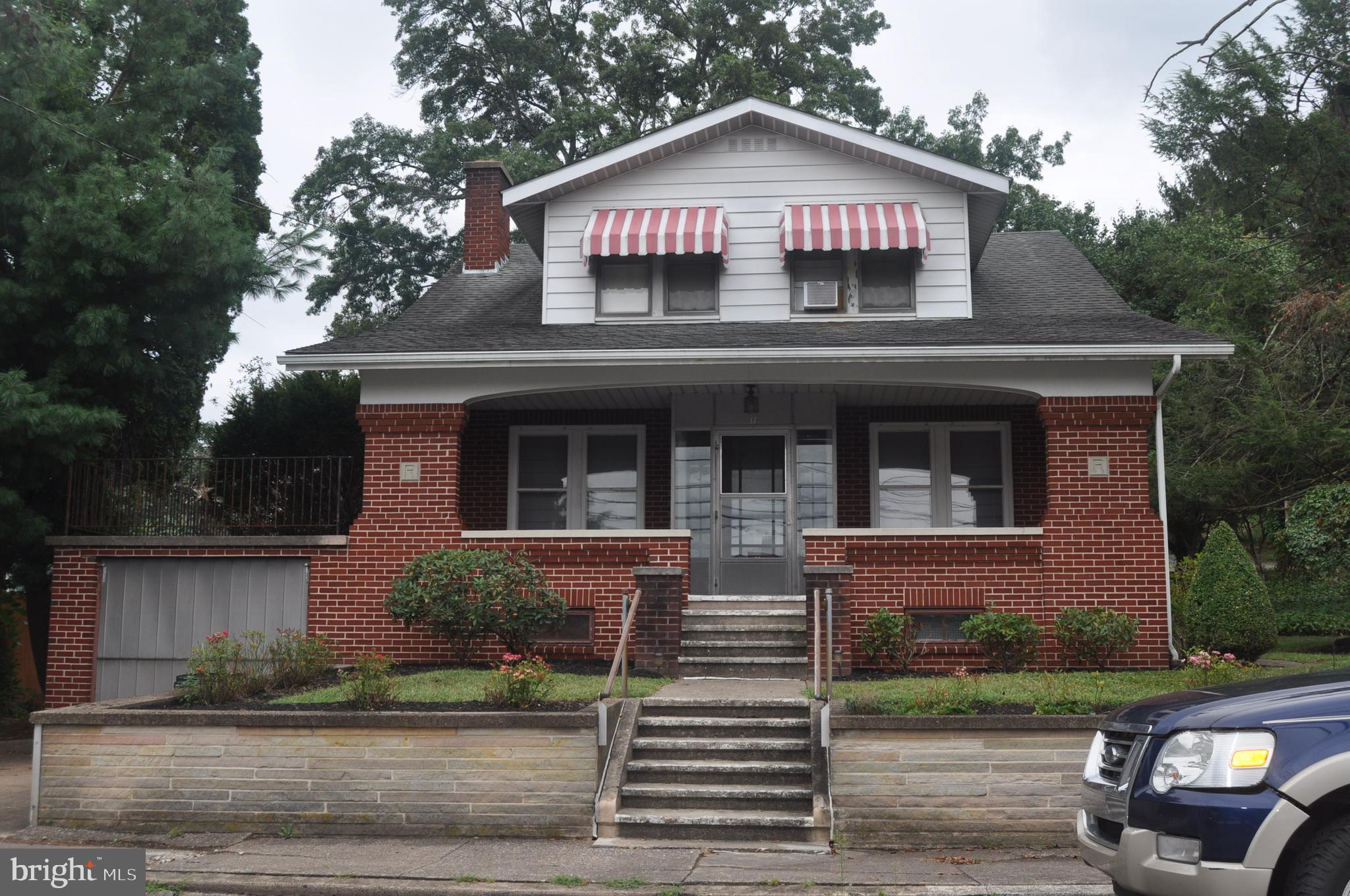 Classic Brick Beauty! Spacious one and 1/2 bath Craftsman style home.
Living room with custom cabinetry, granite countertops and island, formal dining room, office and half bath on first floor. Three bedrooms and full bath on second floor. Beautiful original hardwood floors, natural woodwork and open stairway. Small attached storage area with overhead door and basement access. Relax on covered front porch or rear patio.
Includes second parcel No. 28-004-011. Located across rear alley, 0.23 acre in size with 2-car 24x24 block garage. Tax amount $702.