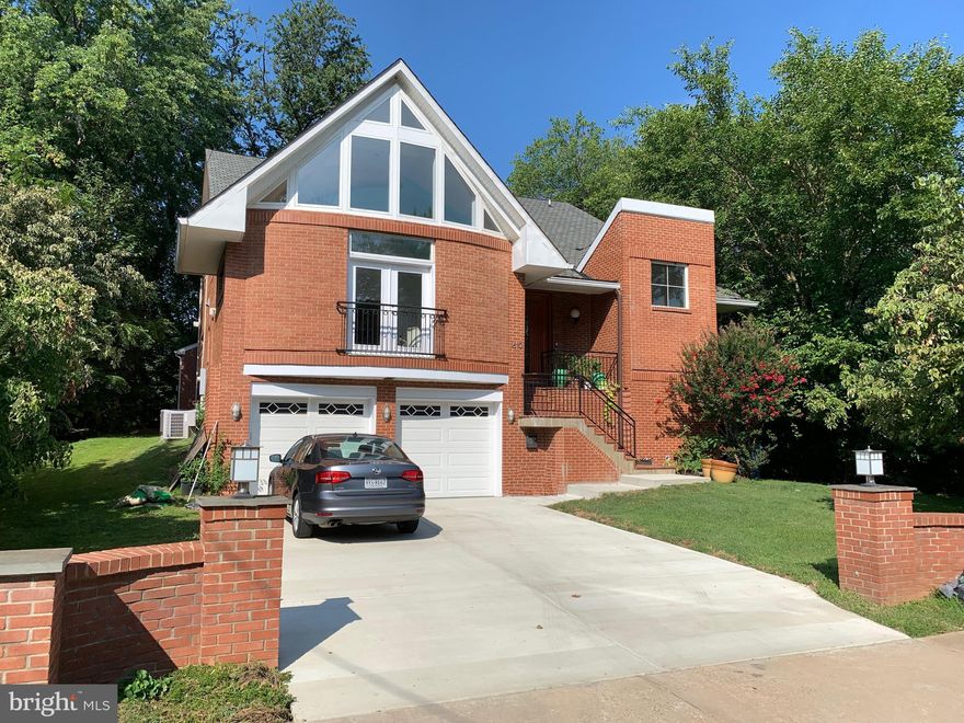 Price Drop! This beautifully, constructed, the 3-story contemporary masterpiece is a must-see.  Enter into an alluring modern foyer w/ high ceilings & solid oak hardwood floors and doors throughout, a spacious formal living area, and an inviting dining room w/ a coffee nook. The formal living area has a stunning custom-designed and patented contemporary artistic (Curved) ceiling. Includes state-of-the-art appliances with Gourmet chef's kitchen w/island, walk-in pantry, Wolf large oven, Thermador 5 burner cooktop, Zephyr hood, Other GE monogram appliances. An elegant open concept kitchen off of sun-filled family room w/ a Modern fireplace with built-in TV and plenty of natural lighting. Spacious master suite w/ a floor to ceiling offering neighborhood views, walk-in closets & decadent bath w/ lavish marble, glass shower, soaking tub & dual sink vanity. Piped-in music is available to all rooms in the house. The finished basement features a rough-in for wet bar, gym area, media room, au-pair suite, and ensuite bathroom. Living and basement areas are ideal for entertaining, accomodating 65+guests. This gorgeous property also features a private home office/ guest suite, opulent light fixtures, 2-car garage, laundry & more.  Ready and wired for electric car charger of 240 volts. Located in the Mclean High school pyramid, come see this one-of-a-kind, upscale custom built and designed masterpiece.