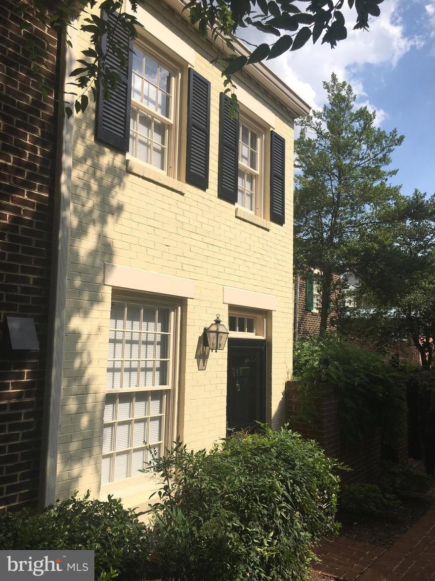 Charming townhouse just 2.5 blocks from King Street. Walk to restaurants/shopping. Half mile to Metro. Updated kitchen with stainless appliances, granite counters and glass tile back splash, new lighting and fixtures. Renovated bathroom with new vanity, floor, fixtures, lights, vessel sink & glass tub enclosure. Wood floors, wood burning fireplace, one parking space, private patio with stairs to street.