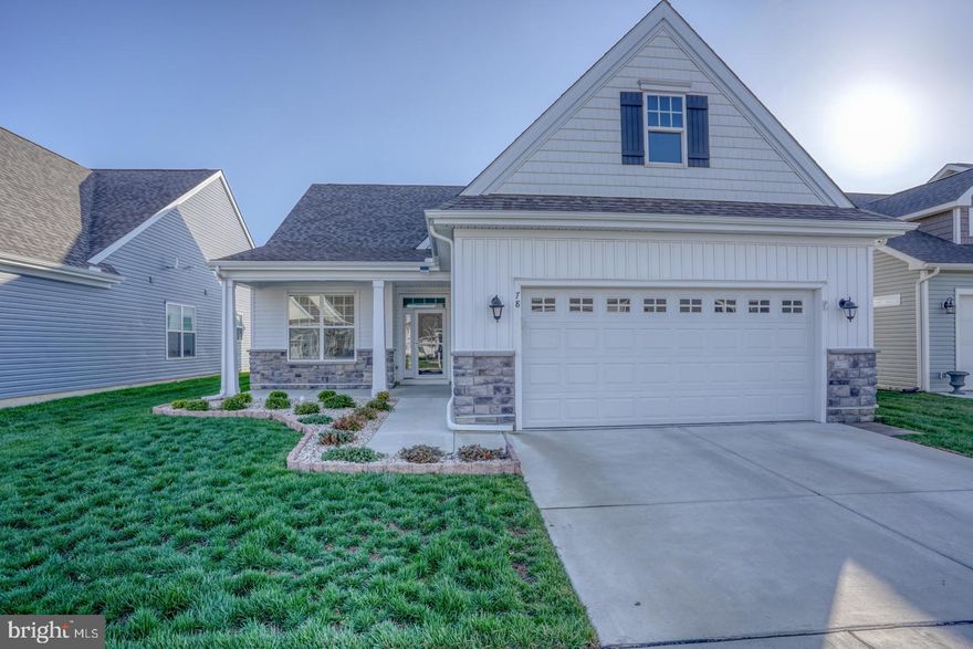 MOTIVATED SELLERS! Come take a look at this lovely gem! Located in the sought after 55+ community of Nobles Pond, this nearly new "Alyssum Craftsman" ranch by Wilkinson Homes offers 2 bedrooms, 2 baths and 2 car garage. Making your way to the front door you'll notice the meticulously maintained landscaping and inviting covered porch. Upon entering, high ceilings greet you creating a spacious feel all through the entire home. The generously sized kitchen w/ angled, raised breakfast bar, boasts granite countertops, upgraded stainless steel appliances, double bowl sink, pantry, an abundance of recessed lighting, 42" cabinets w/ soft close drawers and convenient pull-out shelving and LVP flooring throughout. A private dining area, just off the kitchen, offering plenty of natural light is perfect to serve all your dining needs and entertaining. The kitchen opens to a sizeable living room area, w/ ceiling fan and sliders to the backyard where you'll find an 8x12 patio. Moving through the home and down the hall there are 2 bedrooms and a full hall bath w/ tub surround, comfort height toilet, ceramic tile flooring and linen closet. The expansive primary bedroom offers a massive walk-in closet, ceiling fan, recessed lighting and an additional area you can use as office space or private sitting area. The private bath provides comfort height dual bowl vanity and commode, ceramic tile flooring and seated shower. Convenient access to the garage is just through the roomy laundry area, washer and dryer are included. Other amenities in the home; on demand hot water w/ a Rinnai tankless water heater, electric upgrades for charging your electric vehicle, additional storage shelving in the garage,1-year pest warranty (transferring to the new owners), lawn maintenance and snow removal are included as well. With its thoughtful design, modern amenities and prime location this home offers the perfect blend of comfort and class. Lastly, let's talk about this amazing community! Reasonable HOA fees, award winning clubhouse, beautiful conservatory, library, game room, ballroom/banquet hall w/ seating up to 320 people, swimming pool with Olympic lanes, outdoor kitchen and covered veranda, community gardens, fishing, putting green, walking trails, bocce ball and tennis/pickleball courts. If that's not enough to keep you busy, there is a full-time activities director on staff with a TON of activities available for your enjoyment which will be listed on the community calendar! Don't wait for new construction when this beauty is available immediately! Schedule your showing today and make this lovely home all yours and become a part of this fantastic community! You'll be happy you did!!