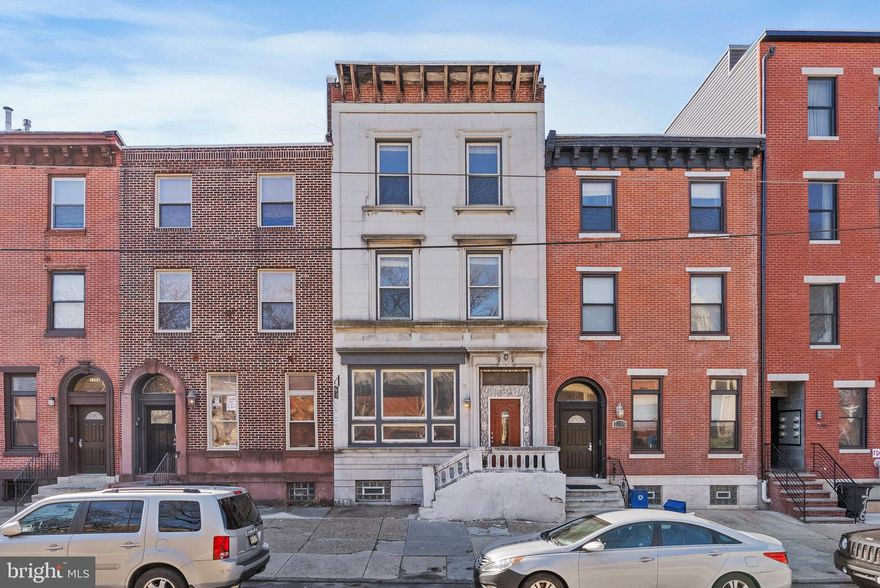 Exceptional Street to Street Triplex in Fairmount with 4-car parking!!! Discover this stunning 20-foot-wide triplex, directly across from St. Joseph’s Prep School. This well-maintained investment property boasts four-car parking in the rear, a rare find in the area. Featuring gorgeous redwood Brazilian floors and oversized windows, each unit is bathed in natural light, enhancing its spacious appeal. The property is fully rented. Unit 1 is a Bi-Level with 1 bedroom plus den, 2 full bathrooms and access to basement laundry. Unit 2 is an open and spacious Studio with 1 full bathroom and private deck. Unit 3 is a massive bi-level with 3 bedrooms, 2 full bathrooms, panoramic views of the Philadelphia skyline from the private roof deck, and an in-unit washer and dryer. The modern kitchens feature cherry cabinets and granite countertops, blending style with functionality. Whether you’re looking to expand your investment portfolio or live in one unit while renting out the others, this triplex offers exceptional value with strong rental income potential. This beautifully updated building also includes a magnificent facade and recently renovated front sidewalk and exterior steps. Taxes and square footage is the responsibility of the buyer to verify independently.
