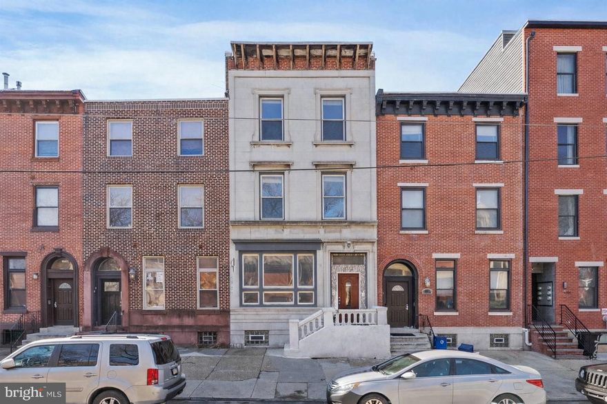 Exceptional Street to Street Triplex in Fairmount with 4-car parking!!! Discover this stunning 20-foot-wide triplex, directly across from St. Joseph’s Prep School. This well-maintained investment property boasts four-car parking in the rear, a rare find in the area. Featuring gorgeous redwood Brazilian floors and oversized windows, each unit is bathed in natural light, enhancing its spacious appeal. The property is fully rented. Unit 1 is a Bi-Level with 1 bedroom plus den, 2 full bathrooms and access to basement laundry. Unit 2 is an open and spacious Studio with 1 full bathroom and private deck. Unit 3 is a massive bi-level with 3 bedrooms, 2 full bathrooms, panoramic views of the Philadelphia skyline from the private roof deck, and an in-unit washer and dryer. The modern kitchens feature cherry cabinets and granite countertops, blending style with functionality. Whether you’re looking to expand your investment portfolio or live in one unit while renting out the others, this triplex offers exceptional value with strong rental income potential. This beautifully updated building also includes a magnificent facade and recently renovated front sidewalk and exterior steps. Taxes and square footage is the responsibility of the buyer to verify independently.