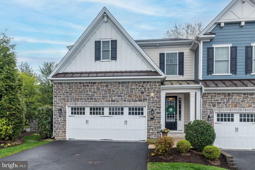 Discover an exceptional opportunity to own a beautifully appointed carriage home in the highly sought-after Fairland at Gwynedd community—where refined design, modern comfort, and effortless living come together. Recognized for its thoughtful planning and vibrant atmosphere, this award-winning community offers a unique blend of elegance and convenience in desirable Lower Gwynedd Township, within the top-rated Wissahickon School District. Just minutes from fine dining, boutique shopping, and daily essentials, the location provides both accessibility and a peaceful residential setting. Step inside this beautiful end-unit carriage home to find a warm and inviting atmosphere that immediately impresses with elevated luxury finishes and a carefully designed interior. Nine-foot ceilings, abundant natural light, and wide-plank wood flooring create a bright, open ambiance throughout the main living spaces. The spacious great room, highlighted by a sleek gas fireplace, seamlessly connects to a generous dining area—ideal for hosting gatherings both large and small. The gourmet kitchen serves as the centerpiece of the home, beautifully designed with high-end appliances, classic white cabinetry, Caesarstone Quartz countertops, and an oversized island perfect for entertaining. The expansive kitchen extends to a fabulous butler's pantry with a separate prep and serving area and a custom designed entertainer's closet and food pantry. Step outside to the most unique and fun "room" in the house, the outdoor living area. The covered TREX deck comes complete with custom automatic privacy screens that you can enjoy in any weather or season. Upstairs, the deluxe primary suite provides a quiet escape, enhanced by architectural detail and generous proportions. Dual walk-in closets offer abundant storage, while the ensuite bath delivers a spa-like feel with double sinks, an oversized glass-enclosed shower, and refined finishes throughout. Two additional bedrooms each include their own private bathrooms and ample walk-in closet space. A conveniently located laundry area completes this level. The finished lower level adds valuable bonus space with a dedicated home office and storage area, ready to adapt to your needs. Whether it’s a media lounge, fitness area, or playroom, the open layout with access to the outside allows for endless possibilities to personalize the space. Every element of this luxury carriage home has been carefully crafted to support a low-maintenance, high-comfort lifestyle. Located in one of Lower Gwynedd’s most desirable communities, this property offers a rare combination of modern design, everyday convenience, and a truly elevated living experience. You'll love living here!