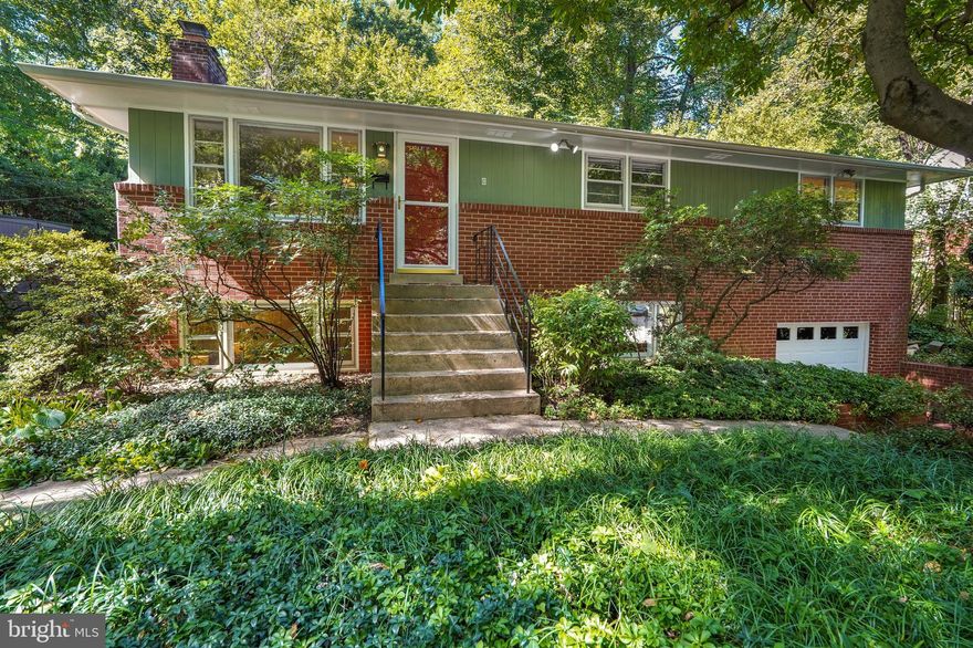 Step inside this enchanting single-family home where modern comforts meet serene living. The moment you enter, you're greeted by an open-concept main level adorned with a cozy wood-burning fireplace and large windows framing idyllic views of the surrounding trees. The kitchen, newly renovated to include a farmhouse sink and dual fuel range, offers abundant counter space and storage solutions, seamlessly extending to the large flagstone patio—your dream space for alfresco dining and outdoor play. Enjoy the ease of hardwood floors throughout the main level, leading you to three well-appointed bedrooms and an updated full bath. The lower level adds extra above-grade living space, complete with a full bedroom, bathroom, and utility room outfitted with a workbench and extra storage. An attached one-car garage adds to the home's convenience, along with a finished storage space at the rear that's perfect for housing outdoor gear, bikes, toys, and more. 

As you venture outside, the home's true sanctuary reveals itself: the expansive and meticulously designed backyard. This tranquil space is framed by a mature tree canopy and enriched by diverse native plant species. A custom hammock platform and garden deck provide a whimsical escape, complete with a rope ladder and climbing wall for the adventurous. Adding to the yard's allure is the 'Studio,' an expertly transformed shed offering an ideal work-from-home environment, equipped with skylights, heating, and cooling for year-round comfort. The unique 'treehouse' vibe of the Studio offers a peaceful retreat, elevating work or relaxation to a new level. 

Set on a tranquil, tree-lined street, this home is nestled within a close-knit community where neighbors are more than just acquaintances—they're friends. Venture outside and you'll find yourself surrounded by a wealth of local parks, including the Sligo Creek Trail just at the end of the block, as well as Jackson Boyd Neighborhood Park and Opal A. Daniels Neighborhood Park. Downtown Takoma Park is just less than a mile away, offering a diverse array of shops, restaurants, and services. This is more than a home; it's a sanctuary where every amenity has been thoughtfully curated to enrich your lifestyle.