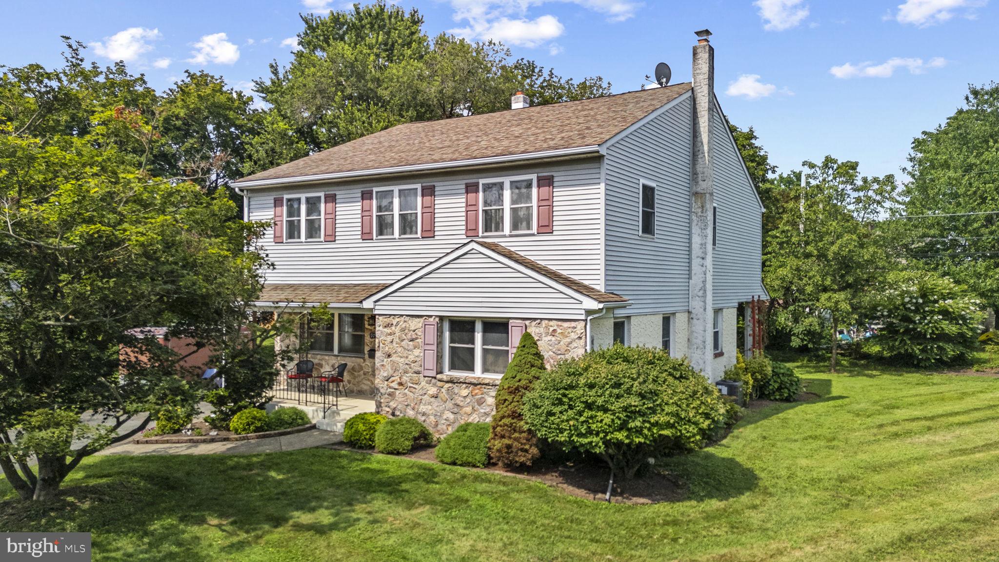 Welcome to 975 Park Drive in Pottstown Boro. This home has so much more to offer than first sight, you have to see it to fully appreciate it and then you will want to make it yours. The home retains its original architectural charm with rounded archways and beautifully finished wood plank and parquet floors throughout most of the first floor. An addition was put on that blends in well with the original charm. There is slate flooring in the front doorway. On the main level there is a very large dining room that could easily accommodate any number of guests for holiday dinners or get togethers with family and friends. There is a huge room that could be an office or a fifth bedroom, especially since there is a full bath next to it. The living room has beautiful built in book cases along an entire wall. All the rooms are saturated with light coming in from many windows. The eat in kitchen is nicely appointed with lots of counter space. Off the kitchen is the addition, which is a sight to behold! Very large, with new cabinets and lots of room to work with. The storage it offers is amazing with a built-in pantry and deep closets with shelving that can hold all your household needs. This house has so much storage space it is hard to imagine. You think of older homes and think small closets and no storage, this home offers so much storage space you will not even be able to use it all! Upstairs you will find the large primary bedroom suite along with three additional bedrooms. The bathroom has a jetted Kohler tub as well as a separate shower. As part of the addition, there is a charming bay window in the upstairs hallway emphasizing the natural light flooding the home. All the bedrooms have numerous windows making the rooms airy and full of light. Carpeting in the hall and bedrooms has been recently replaced. This level has the laundry room, so no need to carry clothes and linens down to the first floor or basement. One closet is almost the size of another room, it is about ten feet deep and five feet wide. All the bedrooms offer large, deep closets with lots of storage space. The hallway has been recently painted. The hall bathroom has a tile floor and double vanity. The basement runs the entire size of the home and is perfect for storage or finishing. There are Bilko doors leading up to the backyard so required access is available.
This charming home is situated on almost a half-acre and is a flat lot for you to enjoy. There is a large deck off the addition that wraps around the back and has stairs leading to a covered patio. There are two sheds to hold all your outside toys. Numerous plantings and trees, including a myrtle crepe tree, burning bush and azalea bushes are situated to ensure a park like setting with privacy to make for pleasant summer evenings. Park Drive is a quiet horseshoe street so it is like living in a small oasis. The driveway is long enough to hold numerous cars so no worries about off street parking. As secluded as the home and area feels, you are still very close to routes 422 and 100. The Philadelphia Premier Outlet, Target, Walmart and Costco are all only a few miles away, along with Montgomery County Community College and Pottstown Hospital. It is also walking distance to a school and there is a playground a few streets away. For those looking for athletic opportunities and social gatherings, the YMCA is only a half mile away and in that same distance there is the North End Swimming pool and Brookside Country Club. Put this one on your list to see as soon as possible, because it won’t last long with all it has to offer!