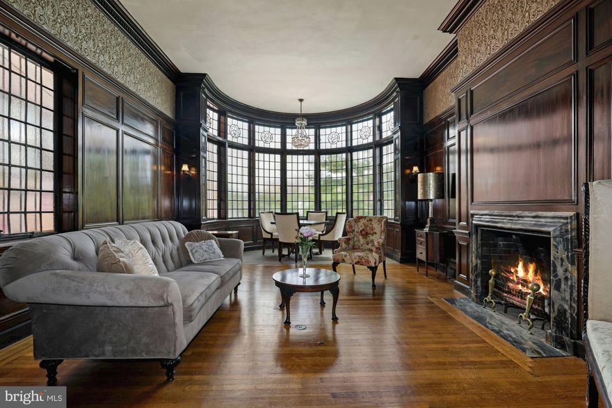 ABSOLUTELY BEAUTIFUL!!! History Abounds in this Most Distinguished, Socially Prominent Home, in The Heart of Mount Vernon.  Massive Iron Entry Door  By Renown G.Krug & Son.   Interior Is A Work of Art with Mahogany Paneling, Doors, Built-in Cabinetry, and Other Stately Appointments.   Wide Hallways and Sweeping Staircase are Adorned with the Finest of Woods, as is the In-Laid Flooring.  Huge Rooms with High Ceilings! Currently Non-Working, the Fireplaces and Mantles are Original!   Tiffany Windows Overlook the Garden.  Lower Level is Large and Could Easily Be A Separate Apartment or "In-Law" Suite.
Off Street Parking is Possible From Rear....Incorporating the Large Current Garden.
Ideally Located in the Shadows of Penn Station, Fine Universities, Historic Museums, the Meyerhoff Symphony, Johns Hopkins Bus, Fine Restaurants, and So Much More!