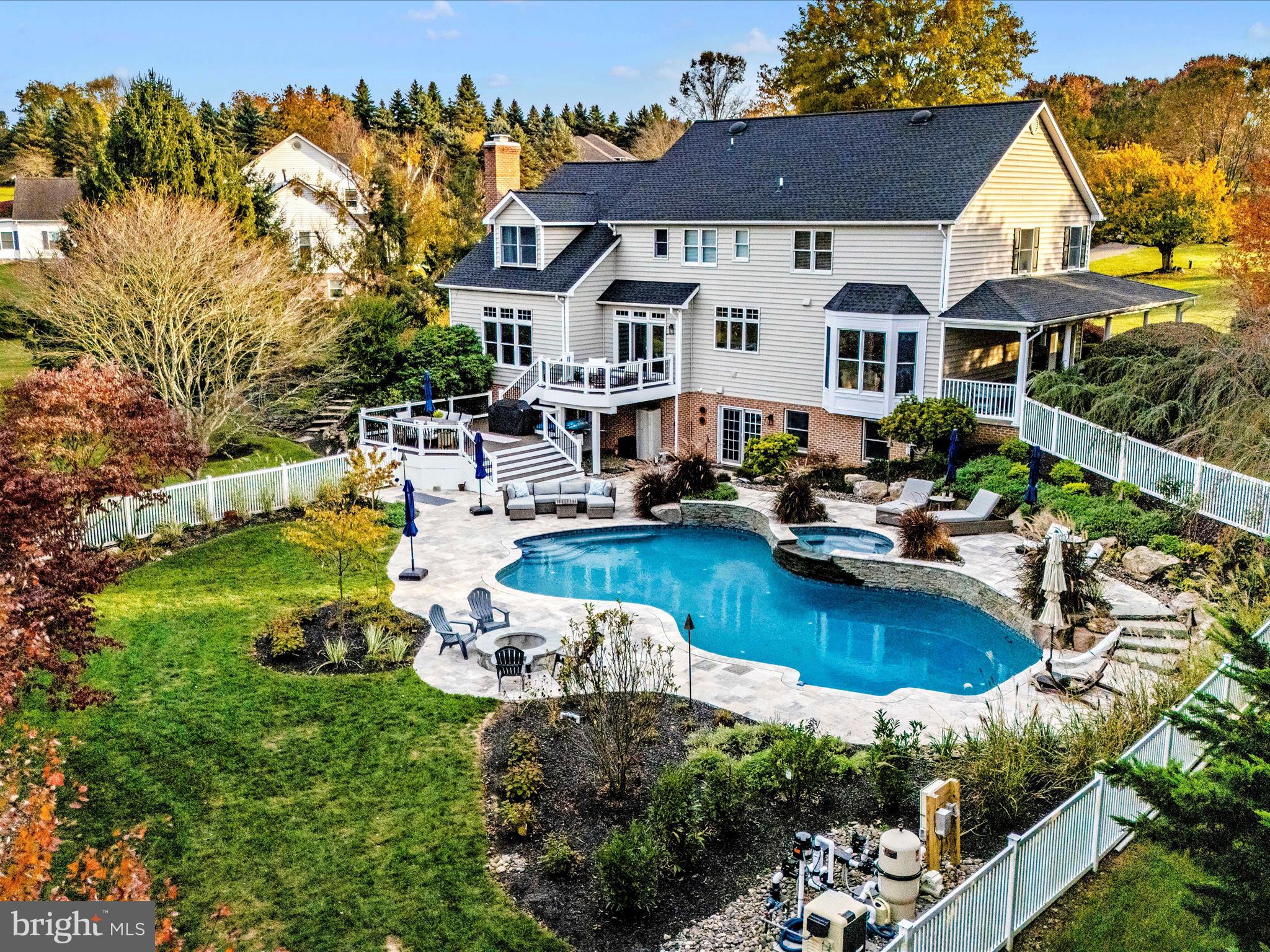 Welcome to this exceptional home, rarely available in the prestigious Doves Landing neighborhood. Nestled on a premium cul-de-sac lot, this beautiful residence backs up to over 40 acres of wooded county conservation land, offering walking trails and a serene stream. This home combines upscale living with timeless elegance, featuring a spacious open floorplan and high-end finishes throughout.
As you approach the home, the inviting wrap-around front porch beckons you to relax and immerse yourself in the peaceful surroundings, perfect for enjoying a morning cup of coffee. Upon entering, the grand two-story foyer leads you into the elegant living and dining rooms, complete with wood flooring, bow windows, crown molding, and built-in bookcases. Handsome solid hardwood floors extend throughout the main level, seamlessly connecting the living spaces, including the kitchen and family room.
The chef’s kitchen is a dream come true, showcasing abundant white cabinetry, professional-grade appliances, a large island with seating, and sleek quartz countertops. The east-facing triple window above the sink overlooks the pool and backyard, filling the space with warm, natural light each morning. The adjoining breakfast room offers access to the tiered deck leading to the pool. The spacious family room is both grand and cozy, featuring a stately brick fireplace and windows that bring in even more natural light while offering views of the backyard and woods.
A private home office, accessible off the foyer, boasts French doors and views of the front yard. The main level is completed with a half bath and laundry room. Upstairs, the opulent primary suite is a true retreat, featuring a sitting room/dressing area, a large walk-in closet, and a luxurious en-suite bathroom with a water closet, double vanity, a large tile shower, soaking tub. and a tranquil view of the pool and backyard.
The upper level is completed with three additional generously sized bedrooms, all with ample closet space. Bedroom 2 features a private en-suite full bath and bedrooms 3 and 4 share a connecting Jack and Jill bathroom with separate sinks.
The lower level offers a media/recreation room, and a spacious open area currently used as a home office featuring LVP flooring, built-in bookcases, wet bar, full-size windows and atrium door opening to the patio, pool, and hot tub. Additional amenities include a full bathroom, workout room, and a large storage room. Outside the backyard is a true entertainer's dream, highlighted by a recently renovated pool and travertine patio. The heated saltwater pool system and recently added hot tub offers hours of enjoyment and relaxation. Situated on a level 3-acre lot, this oasis provides abundant space for outdoor activities, pets, and gardening, all while offering direct access to nature trails in the nearby conservation area.
Doves Landing is located across from Challedon which features a public golf course with a full-service restaurant. Fitness enthusiasts will appreciate the close proximity to Challedon for jogging, walking, or running.
With its exceptional location, stunning features, and impeccable condition, this home is ready for its lucky new owner. Make this New Year unforgettable—schedule your private tour today!