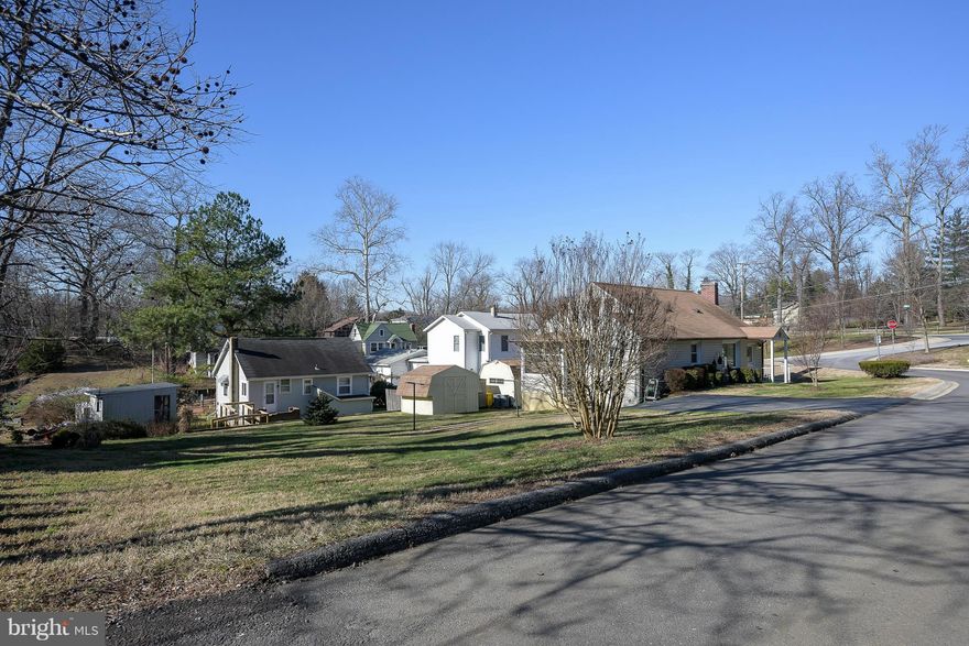 **What a Treasure** Home has been lovingly maintained by Owners for over" 50" years in this WATER Privileged Comm.,GREAT BONES..a little outdated..but awaiting your Personal Touch.Original HARDWOODS Under Carpet, Wood Burning Fireplace,Replacement Windows Throughout,Double Lot,Huge Carport, Garage/Workshop with Electric,Alarm,Cable&Phone. Screened in Porch,Two Sheds...close to desirable amenities.