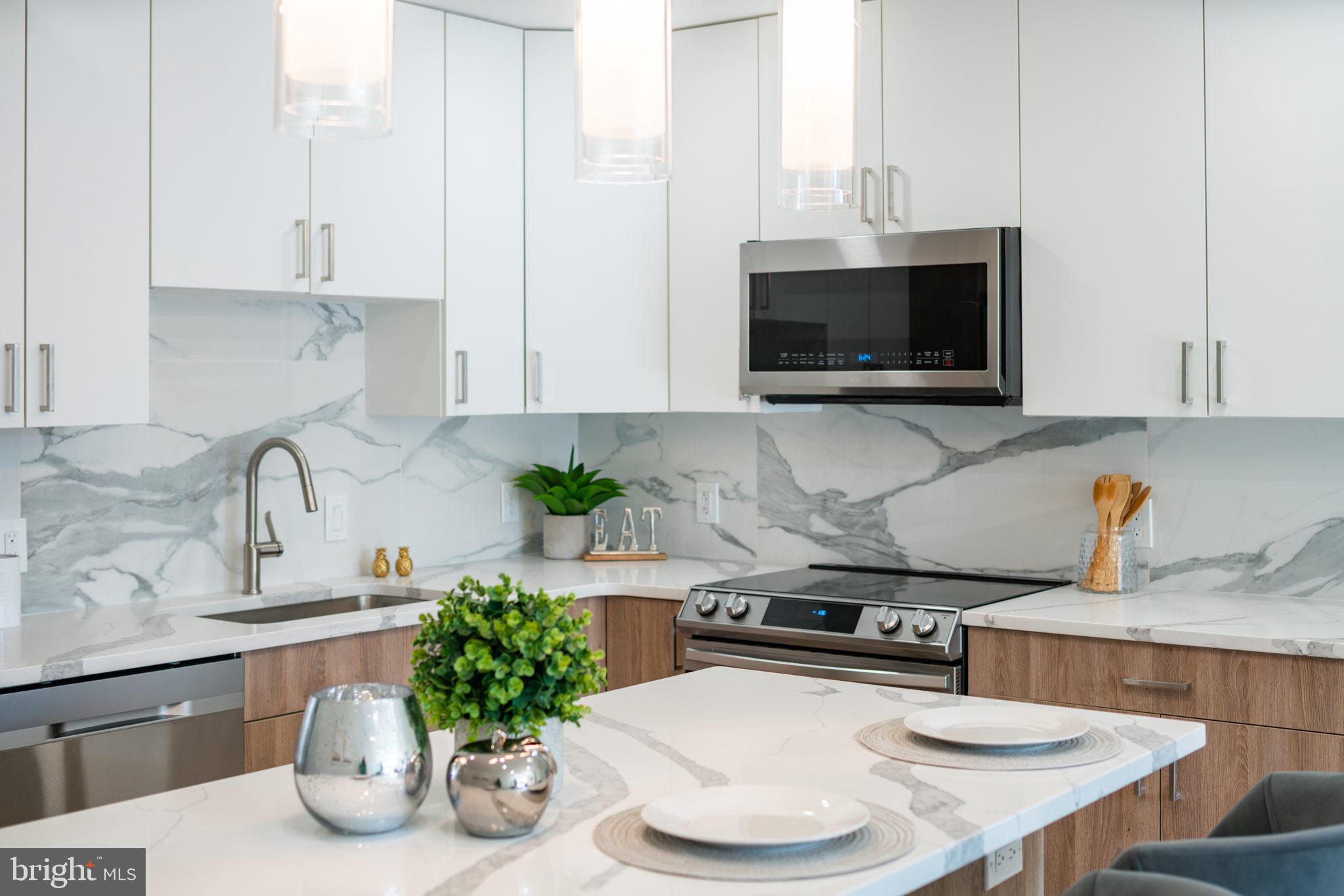 **LIMITED TIME special builder buydown financing available at @ 4.99% interest + $5,000 closing cost assistance on our last available units.**
Setting itself as the new standard for luxury living, The Moyer boasts a unique combination of modern amenities, designer finishes and garage parking while set in what Forbes calls, "America's Hottest New Neighborhood." Designed by renowned local architectural firm Harman Deutsch Ohler, available floor plans offer buyers both one and two bedroom formats with top floor units featuring a private roof-top outdoor space and stunning Center City views. Notable unit features include an open floor plan, 9' ceilings, Gyp-Crete® floor underlayment, floor to ceiling windows, luxury finishes custom European kitchens with quartz countertops, premium wide plank hardwood flooring, Fresca shower columns, in-unit LG washer & dryer and Trane HVAC systems. All units come both Comcast & Verizon ready and feature FULL 10-year tax abatements. The Moyer is located conveniently close to the I-95 exit ramp for quick travel time to New York City and Philadelphia International Airport. You will also find yourself just a stones throw away from popular Fishtown hotspots such as Suraya, Frankford Hall, La Colombe, Punch Line Philly, The Filmore and Rivers Casino. **All listing photos are of model unit #204**