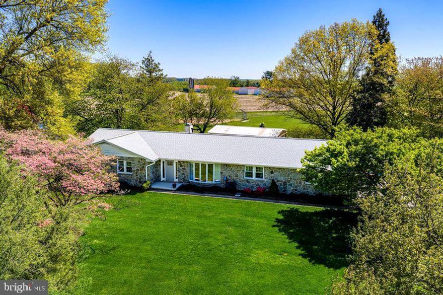 A BEAUTIFUL DRIVE TO COUNTRY LIVING WITHIN 15 MINUTES TO BEL AIR. THIS 3 BEDROOM/2.5 BATH BUTLER STONE RANCHER IS PERFECTLY POSITIONED ON NEARLY 2 ACRES THAT OVERLOOKS A SPORTS FIELD & FARMLAND. HARDWOOD FLOORS. LIVING ROOM HAS OVERSIZED CASEMENT WINDOWS AND PELLET STOVE. KITCHEN IS EQUIPPED WITH CHERRY CABINETRY, STAINLESS APPLIANCES, EAT-IN TABLE SPACE, BREAKFAST BAR, AND CUSTOM BUILT-IN PANTRY AND STORAGE. SIDE PATIO ENTERS IN TO A BRIGHT MUDROOM. PRETTY POWDER BATH. FAMILY ROOM OFF KITCHEN IS COZY W/WOOD BURNING FIREPLACE W/STONE SURROUND AND RAISED HEARTH. PRIMARY BEDROOM W/2 CLOSETS AND EN SUITE W/DUAL VANITY, SOLID SURFACE COUNTERTOPS, AND WALK-IN SHOWER. ALL BEDROOMS GOOD SIZED. BLACK & WHITE TILED HALL FULL BATH. BASEMENT IS PARTIALLY FINISHED WITH A RECREACTION ROOM W/WOOD STOVE, LAUNDRY ROOM INCLUDES WASHER/DRYER/UTILITY SINK, 2 STORAGE SPACES, BONUS ROOM READY FOR YOU TO FINISH, AND WALK OUT TO REAR PATIO. 40X20 BARN HAS POTENITAL MULTI-PURPOSE USE. 12X10 GREENHOUSE. NEARLY LENGTH OF HOUSE SCREENED PORCH IS FOR OUTDOOR LIVING, PEACE, AND TRANQUILITY. 2 CAR GARAGE AND DRIVEWAY W/5 CAR PARKING PAD. ROOF 2026. HVAC/AC 2026. WASHER/DRYER 2025. REPLACEMENT WINDOWS. 2 WATER HEATERS 2018/2024.POWDER BATH 2025. SIDE PATIO 2025. FRONT PATIO 2024. CONVENIENT TO ROUTES 543 & 165, FALLING BRANCH BREWERY, GENEVA FARM GOLF COURSE, LOCAL FARM STANDS, AND MINUTES TO PENNSYLVANIA.