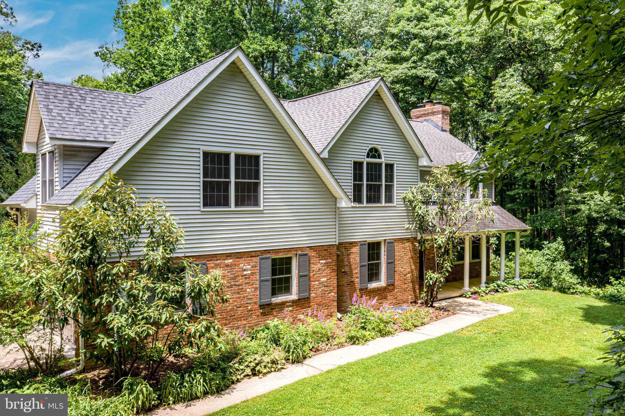 Welcome Home! Beautiful house on a private and serene 2.27 acres. Greet guests in the inviting foyer with slate floor. In the family room, you will find hardwood floors, a sliding glass door to the deck, a large picture window, and a brick fireplace with a wood stove insert. Head to the kitchen which boasts cherry cabinets, a small-appliance garage, a breakfast area for casual meals, and a window overlooking the deck and back yard. A large, walk-in pantry offers more storage space than you could imagine. Enjoy more formal meals in the separate dining room. Spend evenings relaxing in the great room with high ceilings, large windows that allow natural light to flood the room, a wood-burning fireplace with a stone surround, and a sliding glass door to the deck. Enjoy the convenience of the main-level bedroom that could also be a den or private office. The mud room with laundry hook ups and a half bathroom round out the main level of this home. Retire at the end of a long day to the master bedroom with cathedral ceiling, ceiling fan, walk-in cedar closet, and a walk-in standard closet. Unwind in the en-suite master bathroom with a jetted soaking tub, separate shower, two sinks, and a cathedral ceiling. The huge bonus room, built above the garage, includes a large storage closet and a separate entrance. The possible uses for this room are endless. In one of the three additional bedrooms you will find a staircase leading to a partially finished attic space. Make it a music room, play room, or hang out spot, whatever you can imagine can be done! In addition to this space, there is also a set of pull-down stairs to access the main attic from the second-level hallway. The two additional, well-appointed bedrooms and a bedroom-level laundry room complete the second level of the house. In the lower level you will find large, partially finished areas that have limitless potential, featuring two brick, wood-burning fireplaces, one with a wood stove insert. The lower level also contains a third full bathroom and a utility/storage room. If you are looking for a peaceful respite, then this is the house for you. Step out onto the large deck perfect for outdoor entertaining and enjoy the quiet, wooded surroundings. Located at the bottom of a dead-end street, this house offers the privacy you have been looking for. It is a must see!