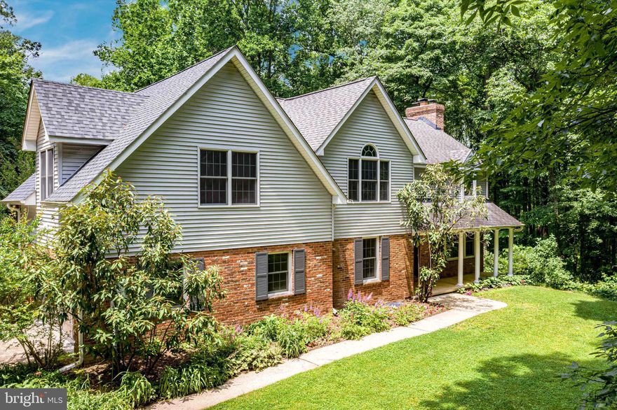 Welcome Home!  Beautiful house on a private and serene 2.27 acres. Greet guests in the inviting foyer with slate floor. In the family room, you will find hardwood floors, a sliding glass door to the deck, a large picture window, and a brick fireplace with a wood stove insert. Head to the kitchen which boasts cherry cabinets, a small-appliance garage, a breakfast area for casual meals, and a window overlooking the deck and back yard. A large, walk-in pantry offers more storage space than you could imagine. Enjoy more formal meals in the separate dining room. Spend evenings relaxing in the great room with high ceilings, large windows that allow natural light to flood the room, a wood-burning fireplace with a stone surround, and a sliding glass door to the deck. Enjoy the convenience of the main-level bedroom that could also be a den or private office. The mud room with laundry hook ups and a half bathroom round out the main level of this home. Retire at the end of a long day to the master bedroom with cathedral ceiling, ceiling fan, walk-in cedar closet, and a walk-in standard closet. Unwind in the en-suite master bathroom with a jetted soaking tub, separate shower, two sinks, and a cathedral ceiling. The huge bonus room, built above the garage, includes a large storage closet and a separate entrance. The possible uses for this room are endless. In one of the three additional bedrooms you will find a staircase leading to a partially finished attic space. Make it a music room, play room, or hang out spot, whatever you can imagine can be done! In addition to this space, there is also a set of pull-down stairs to access the main attic from the second-level hallway. The two additional, well-appointed bedrooms and a bedroom-level laundry room complete the second level of the house. In the lower level you will find large, partially finished areas that have limitless potential, featuring two brick, wood-burning fireplaces, one with a wood stove insert. The lower level also contains a third full bathroom and a utility/storage room. If you are looking for a peaceful respite, then this is the house for you. Step out onto the large deck   perfect for outdoor entertaining   and enjoy the quiet, wooded surroundings. Located at the bottom of a dead-end street, this house offers the privacy you have been looking for. It is a must see!