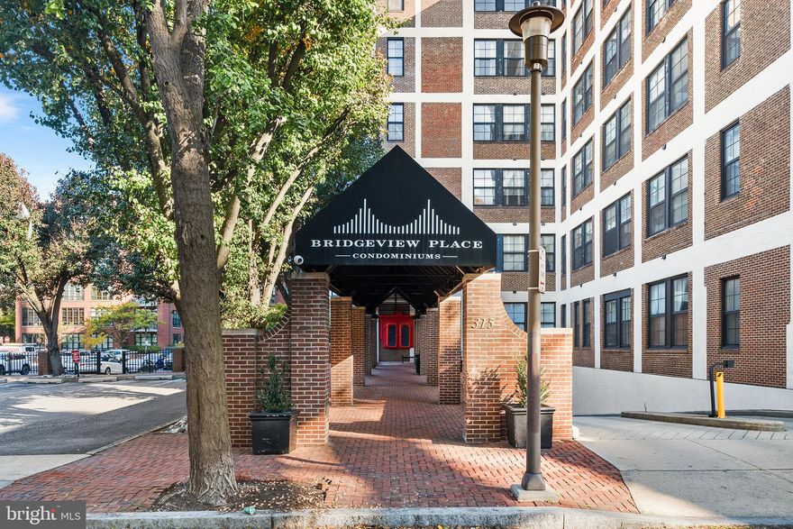 Introducing a beautiful 1 bedroom condo with garage parking in the heart of Old City! Welcome to The Bridgeview, a secure, professionally managed, pet-friendly building within blocks of boutiques, restaurants, theaters and bookstores. As you enter unit 614, you are greeted with a convenient hall closet and a bright kitchen complete with white cabinetry, an abundance of counter space and clear sight lines to living and dining areas. Host the next dinner party- the designated dining area allows plenty of space to entertain! The exposed brick and oversized windows accent the tall ceilings and bathe the airy living and dining areas in natural light. The well sized bedroom boasts soaring ceilings, 3 generous closets, another exposed brick wall and more large windows. Gleaming hardwood floors flow throughout the entire unit and the neutral bathroom includes a stacked washer and dryer tucked away in the laundry closet. Enjoy sunsets and city views from the the communal roof deck or fresh air and greenery from the community courtyard. A friendly front desk attendant greets guest and helps with easy package delivery. A private storage locker is located on the same floor as the unit and your deeded parking spot in the secure garage is the cherry on top! Old city has plenty to offer: Stroll the cobblestone streets throughout Elfreth's Alley. Take a bike ride along the Delaware River trail or gallery hop during First Friday. However you like to spend your free time, Old City has it all. Now you can make your city living dream a reality in one of Philadelphia's most historic and happening neighborhoods!