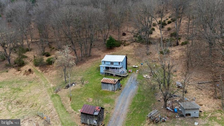 Tucked away in the peaceful mountains of Hardy County, West Virginia, this 3.28-acre retreat (offered in two parcels) is the perfectopportunity to create your own getaway or full-time homestead. The 1,232 sq ft farmhouse is ready for renovation and your personal vision, ideallypositioned to take in tranquil views of a neighboring pond. Step outside and enjoy the natural surroundings—walk up to your own deer stand, start agarden, or bring animals and make full use of the two existing sheds and open space. With HardyOneNet fiber optic internet available, you can stayconnected while enjoying the quiet of country living. Property is being sold as-is, where-is—bring your ideas and make it your own mountain escape. ViaGoogle Maps 52 minutes to Harrisonburg, 1 hour 21 minutes to Winchester and 43 minutes to Moorefield, WV.