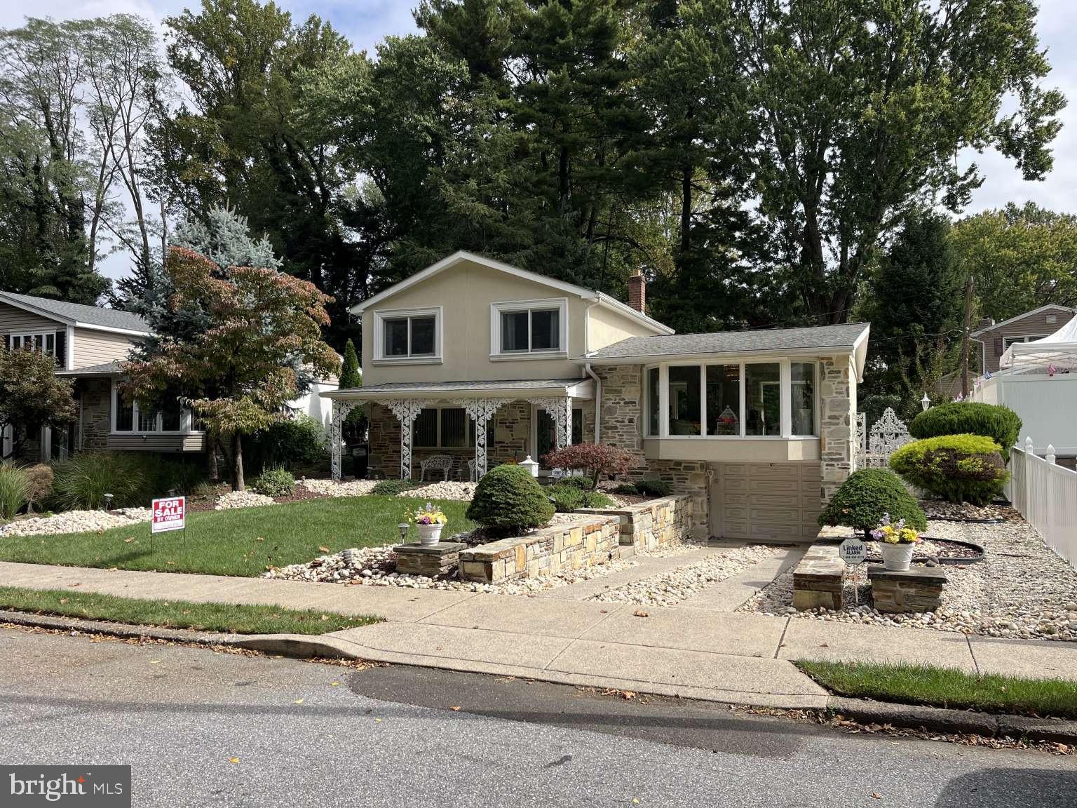 Welcome to your new home. Bring your offers! This beautiful split level can be yours today. This home offers plenty of space to entertain guests and enjoy everyday living. This hidden gem sits nestled in a highly desired neighborhood in the great Northeast. As you enter this rarely offered home you'll enter into the spacious family room with a stone fireplace, a convenient 1/2 bath, and a jacuzzi room and walk in Closet. With a generous split-level layout there are multiple living and entertaining spaces, including a large living and dining rooms on the primary level. A bright roomy kitchen with ceramic tile floors and white cabinetry. There is also enough space for a breakfast table. Off the kitchen is a set of stairs that will take you to the third level where you will find 3 bedrooms and a hall bath. The Master has a private deck and bath with a stall shower. The laundry room is on the lower level, with exit door that leads to the one car garage, Big private 2 car driveway-lots of street parking. front/back/side yards. Schedule your showing today!