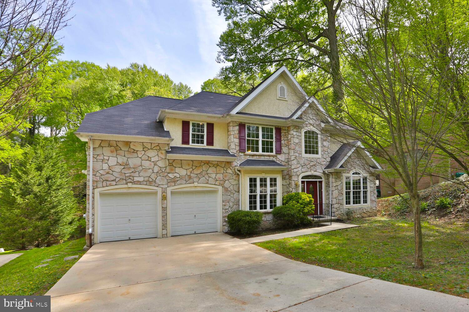 This pristine, spacious and light-filled four bedroom Colonial single is situated on a half acre of rolling grounds in a park-like setting just a stone's throw from Fairmount Park and the Wissahickon. Built in 2003 the home has been restored and updated since. There is an expansive state of the art kitchen with corian counters, stainless appliances, lots of cabinetry including extra tall wall cabinets, deep pull out drawers and a wonderful eating counter. The adjoining breakfast nook opens to a deck overlooking the sweeping rear yard which extends up a wooded hill. Adjoining the kitchen is the large family room with vaulted ceiling and two levels of windows flanking the gas fireplace. The first floor also includes the living room, dining room, 2-story atrium entrance hall, laundry room and powder room. The four bedrooms upstairs are all a good size, especially the main bedroom suite which includes an enormous walk-in closet and luxurious spa bathroom with walk in shower and soaking tub. This bedroom opens to another deck overlooking the picturesque grounds. There is central air and an attached 2-car garage. This is a fabulous home in a convenient location with easy access to the expressway, Kelly Drive and other major arteries. The East Falls train station with service to downtown and the suburbs is nearby as are a growing number of shops and eateries adding to the enjoyment of living in East Falls. Center city is 10 minutes away. A unique rental opportunity!.