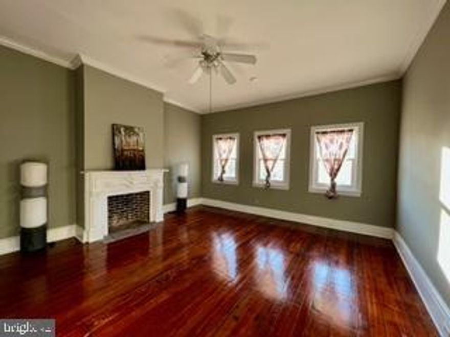 This Grand Dame property is the epicenter of fun in Baltimore. Overlooking the Fells Point square is like having your finger on the pulse of the city. Casual strolls along the waterfront, open-air festivals, the farmer's market on Saturdays, eclectic  boutiques, and so many dining options provided by the area bars and restaurants are here. Inside, the high ceilings can reach 11', and period details like a great staircase and two fireplaces lend an air of elegance. Commodious in space, with a dedicated laundry room, storage areas, and a kitchen, with an adjoining living areas, will provide more than ample space for fun gatherings indoors, while the private courtyard will handle the al fresco ones. After an extensive refresh, this unique property is now available for leasing.