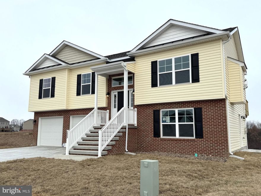 Under Construction in Heritage Hills.   4 bedroom/ 3 full bath Split Foyer in Heritage Hills.  Home features open floor plan with vaulted ceilings in Family Room, LVP Flooring in main living areas, Natural Gas Fireplace in Family Room w/ mantle and Granite surround, and kitchen with island, granite countertops, recessed lighting, and stainless steel appliances.  The lower level offers additional living space with finished rec room, 3rd full bath and 4th bedroom.  Brick accents on exterior front and foyer,  Covered front porch/ foyer entry, 10x12 rear deck, and concrete driveway included.