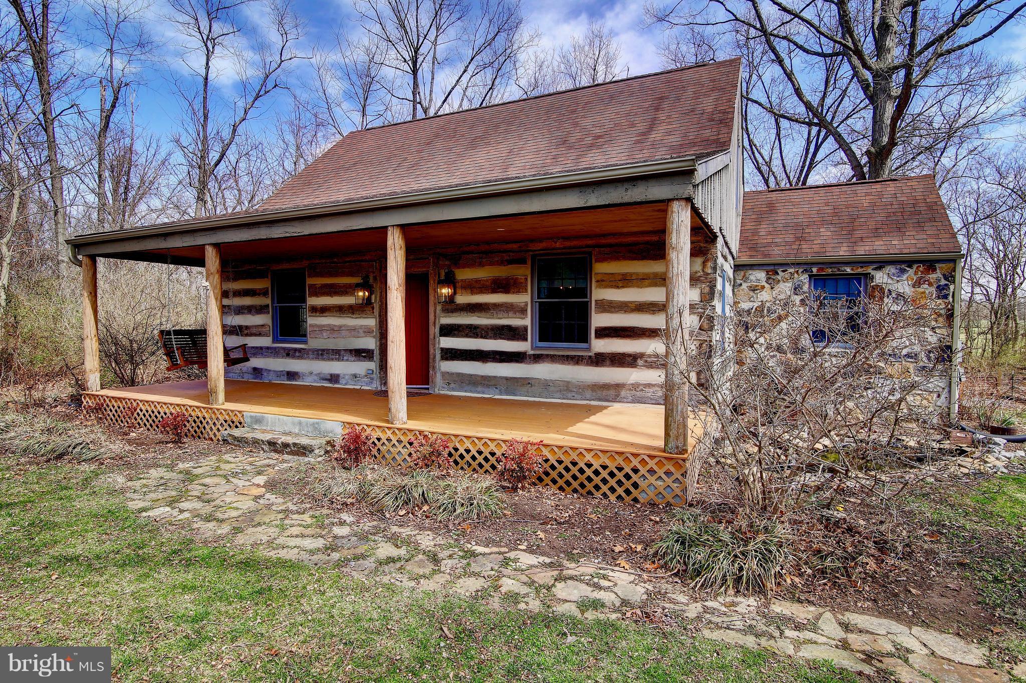 This Custom Log Home, built in 1999 w/ true Chink & Mortar construction sitting on 2 private acres is a gem! Designed to look like the mid 1800's,built of reclaimed 1849 timbers from Hanover, PA ,WV stone,and 1" milled oak floors displaying top quality. 1st floor Master BR/BA and open kitchen. FR w/woodstove, 2 addt'l BR on upper level with vaulted ceilings. Dbl pane windows and period fixtures