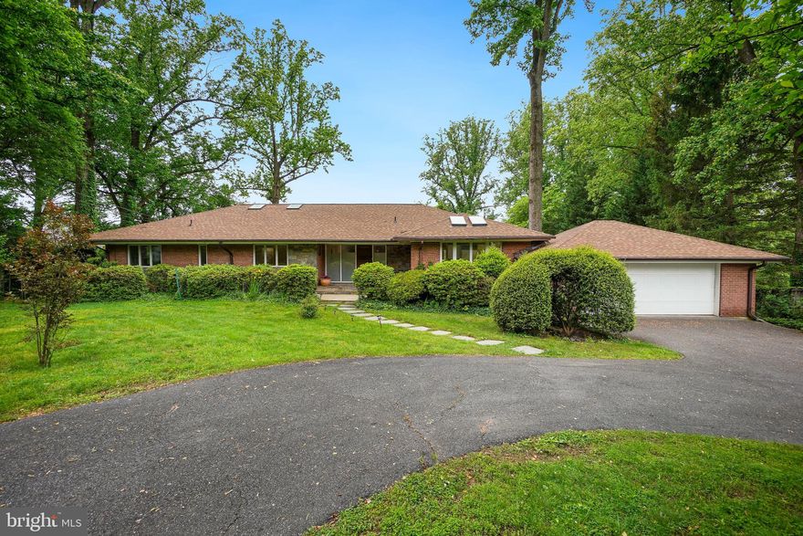 Welcome to 7011 Oak Forest Lane! This 6 bed, 4.5 bath rambler is perfect one-level living. Located on an over half-acre lot with a pool, this home is the ultimate retreat. Enter in and notice the amount of natural light that shines through. The spacious living room includes a fireplace and doors to the back deck with steps down to the backyard. Right off of the living room is the formal dining room as well as the kitchen. With beautiful skylights and access to the garage, this is a culinary dream. This level hosts the primary bedroom suite with a walk-in closet, spa-inspired bath, and private access to the back deck. This level includes 3 additional bedrooms as well as a hall bath. As you make your way to the lower level enter into the large rec space. The rec space includes a bar, a fireplace and doors that flow right into the backyard, perfect for entertaining. This level includes a small kitchen, a storage area and 2 additional bedrooms and 2 bathrooms. The backyard includes a back patio, back deck and a pool. Located in the Whitman School cluster and minutes from downtown Bethesda, make this your perfect home!