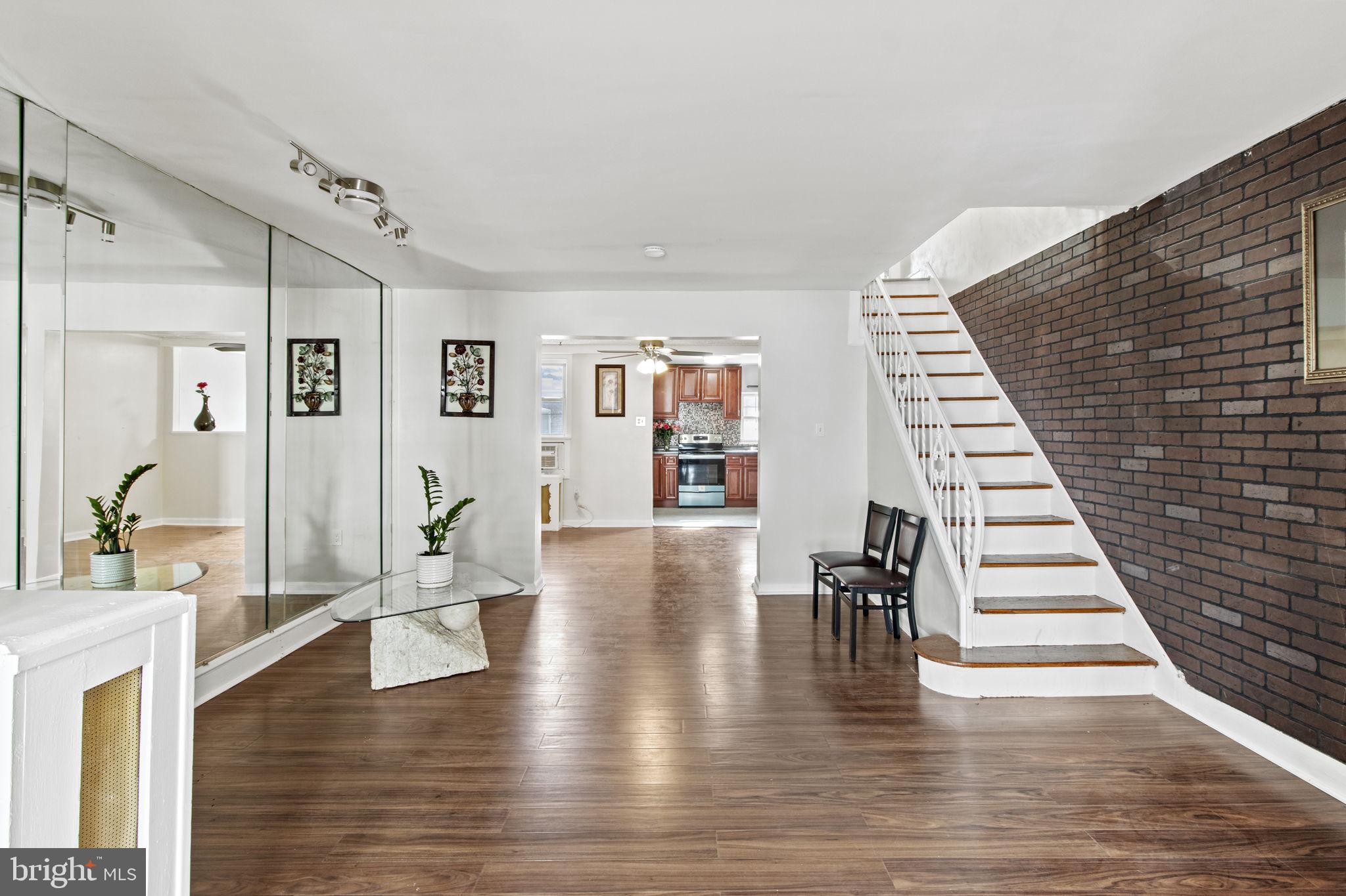 It is my distinguished honor to present to you 6928 Garman St. Located in the Southwest Philly, where legends are made, The property is anchored by a Commercial & industrial Mixed Use Corridors on Woodland Ave & Elmwood Ave and surrounded by Elmwood Park, Tilden Middle School, Amazon, and other institutions. Situated at the intersecting sections of Southwest, Elmwood has undergone a radical transformation and evolution in the last few decades, from the industrialization of Philadelphia to residential development & commercial corridor revitalization & the progression of business enterprise. The first floor is a spacious living room, and dining room both with built in mirrors which makes a great accent piece for the area. Across from it is a beautiful kitchen with new cabinets, gorgeous modern kitchen style backlash, and new appliances. Upstairs is a 3 bedrooms with closets, a beautiful hallway bathroom with impressive tiles and new vanities. There is a full finished basement and an impeccable full bath. The basement can be used for storage, laundry room or your specific needs. There is walkout door to the private parking in the rear and street parking in the front of the house.
 The property is filled with radiant natural light and illumination, leading into a serene fenced in front yard with beautiful landscaping including new mulch and herbology, where you can spend summer nights grilling & hanging out with your loved ones. Positioned on the middle corner of the block with ample and convenient street parking on both sides, in a secluded block with curb appeal and charm., The main floor has a spacious living room and dining room, leading into the kitchen & basement entry. The basement is finished with a full bathroom and egress to the backyard. The laundry area has great storage space. Walk up the steps to the 2nd floor and you will find 3 bedrooms and a full bath. The bathroom is spacious and has natural light to create serenity and peacefulness in one of the most sacred sanctuary in our lives. The subway backsplash tiles adorn the tub area up the wall. This property is located near some of the best universities and educational institutions in the world, including the University of the Sciences of Philadelphia in driving distancing or public transportation directly to the University of Pennsylvania & Drexel University. Close to trolley & bus stop Set roots in the City of Brotherly Love & Sisterly Affection, from monstrous skyscrapers, to the stadiums, to the Delaware River, & surrounding landscape of the great City of Philadelphia. Developers are building up apartments off of 52nd & Chester Ave around Springfield. There are a lot of building infrastructure & Amazon’s Distribution Center will be constructed in this area, where they are hiring a lot of people. This home is move in ready for a family or can be renovated and sold for a higher market value. Many investors have completed acquisitions, renovations and resales in this area with high end interior design and aesthetics. The property is close to trolley and bus stops, and less than 10 minutes from MFL 40th Street Station. and close to multi-modal public transportation, 1-76 highway. Surrounding this area are businesses such as coffeeshops & cafes, eclectic and multicultural cuisine and food establishments along Woodland Ave.. Some of the best food is located in the heart of Southwest/West Philadelphia for individuals of all dietary regiments. We thank you for your consideration and we look forward to doing business with you. We will ensure a professional and respectful transaction for all parties and we wish you luck in the search for your new home in the City of Brotherly Love & Sisterly Affection.
