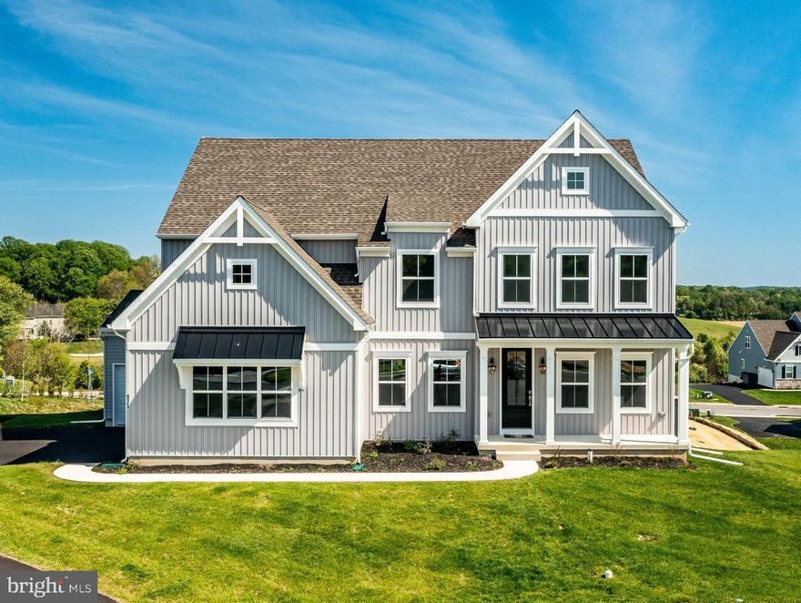Welcome home to refined Living!  From the moment you arrive, this exceptionally constructed, late 2025, five bedroom, three full and one half bath residence sets itself apart with premium board and batten siding and a 2-car side-load garage with an additional 3rd bay. Step inside to the thoughtfully designed Main Level and discover a layout designed for the way of life you actually live. Just off the Garage is a convenient Mud Room with a coat closet. Prepare to fall in love with a Kitchen built for both the home cook and the passionate entertainer with $69,000 worth of upgrades. The Chef's Kitchen showcases beautiful Kinsdale cabinets with solid doors and under-cabinet lighting that adds warmth and ambiance. The raised countertop is finished in magnificent quartz counters and accented by elegant corbel brackets. Appliances include a GE Monogram induction 5 burner cook top upgraded with a top-of-the-line tile backsplash that extends dramatically to the ceiling behind the wall-mounted vent above. The oversized island features additional base cabinets, end panels, and a five seat Breakfast Bar. A large LG refrigerator, Kitchen Aid double ovens, microwave and Kalamera wine fridge complete this exceptionally well designed Chef’s Kitchen. There is an expanded Pantry Closet offering generous storage. Engineered plank flooring throughout the main level presents a seamless, high-end finish. The Breakfast Area expansion is a showstopper, bathed in natural light beneath a soaring cathedral ceiling and framed by a beautiful rear arch-top window. The adjacent Family Room is nothing short of breathtaking, featuring an upgraded ceiling height and a magnificent wall of nine windows arranged in three rows and anchored by the warm glow of a Roosevelt gas fireplace. The home’s Dining Room and Home Office flank the front door. A private first-floor Guest Suite offers comfort and independence for visitors, complete with a full bath and walk-in closet. The first floor boasts a stylish Powder Room featuring a vanity cabinet with cultured marble counter that welcomes guests in style. Upstairs, nine foot ceilings elevate the entire second floor. The Primary Suite is a true sanctuary, finished with top-of-the-line carpet for plush comfort underfoot. The spa-inspired Primary Bathroom looks straight out of a magazine! You will love the walk-in shower with designer tile and quartz countertops for a clean, contemporary feel. Tired after a long day? The soaking tub is perfect for easing your weary bones. The Primary Walk-In-Closet is found through the Primary Bathroom. Bedrooms 2, 3 and 4 offer the same high-quality carpet, and each has its own walk-in closet. These rooms share a beautiful Hall Bathroom. The dramatic Upper Level Landing has a beautiful view of the Family Room and breathtaking views out of the wall of windows. Note the home’s Laundry found at the top of the stairs next to the Primary Suite. The Lower Level is primed for your vision. A full egress window brings in natural light and rough-in plumbing for a full bath sets the stage for future expansion. A 16' x 16' concrete patio just off the basement creates the perfect outdoor extension for entertaining or relaxing. This home’s location is without equal as you will be steps away from a 200 acre Township park with miles of walking trails and set in a highly sought-after Downingtown Area School District, home of the prestigious STEM Program! The lucky owner will get all of this at a bargain price!