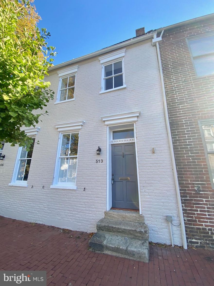 Spacious three-bedroom townhouse in the heart of downtown Fredericksburg on Caroline Street, just a few blocks from the train station. This home was fully updated in 2021 with a new kitchen and renovated bathrooms while still preserving its historic charm. Inside you’ll find soaring 10-foot ceilings, beautifully refinished original hardwood floors, and fresh paint throughout.

The kitchen features crisp white cabinetry, leathered granite countertops, stainless steel appliances, and a stacked washer and dryer for convenience. Step right out from the kitchen onto a private brick patio and fully fenced backyard, perfect for relaxing or entertaining