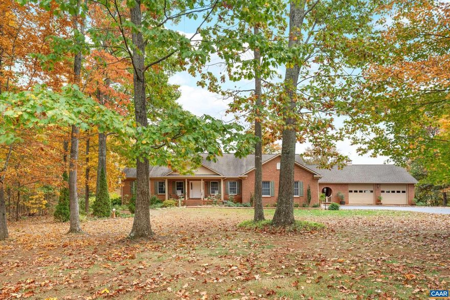 Located minutes from Gordonsville in the desirable Hare Glen neighborhood, this well maintained home has many great features. The 4 bedroom, and 3 full bath brick home has a large living room with fireplace, eat in kitchen with custom hardwood cabinets, master bedroom, and bath, formal dinning room, large screened in porch, and laundry, all on the main floor. most of the main floor has hardwood flooring. The partially finished basement has a large den with fireplace, and wet bar, bedroom with full bath, and a large storage room. The 2.2 acre lot has plenty of room for gardens, and the back of the house has a beautiful eastern view overlooking farm pastures. the home also has garages with 3 bays.