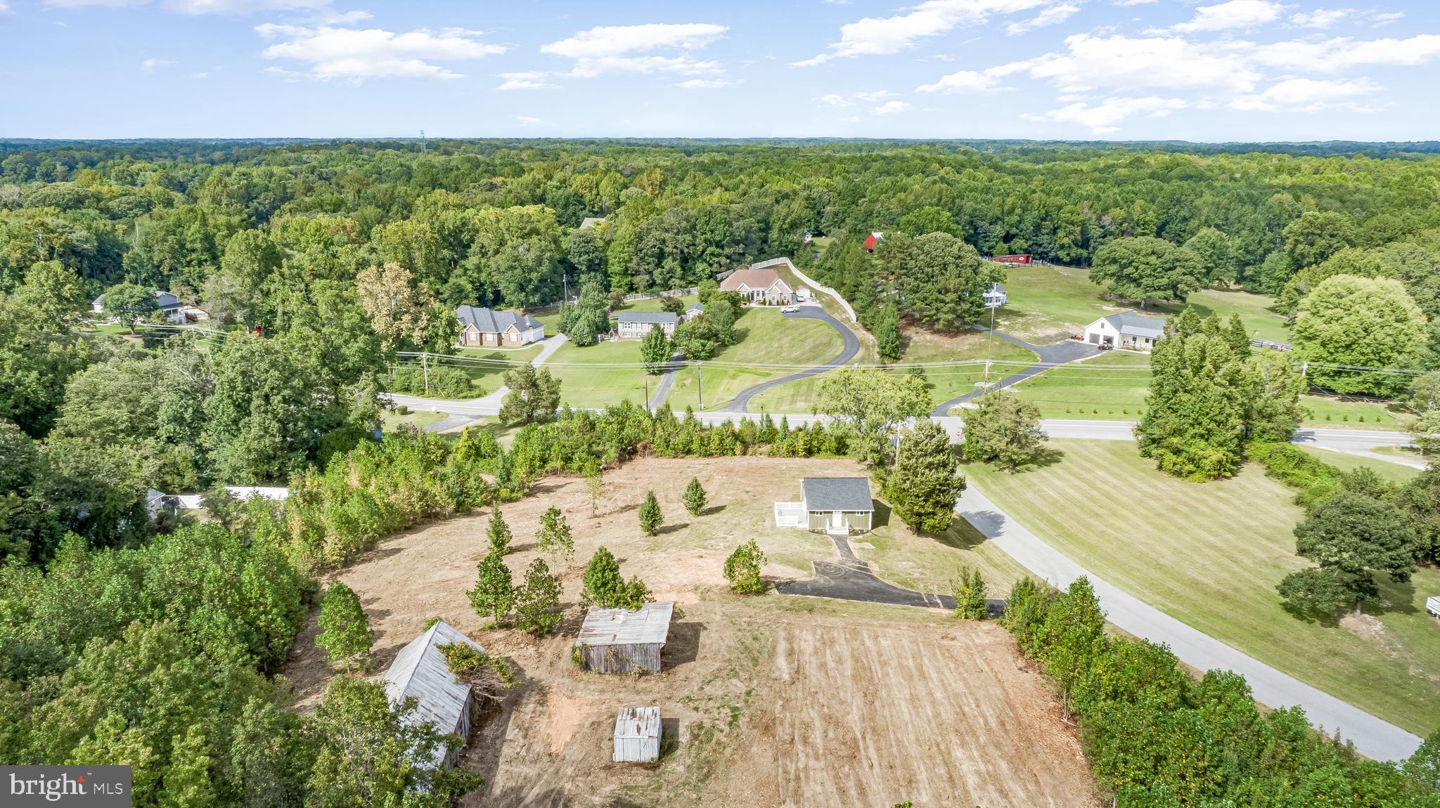 This original farmhouse sitting on 6.5+ acres has been completely redone top to bottom inside & out while maintaining its rural character. A full interior & exterior rehab was completed in 2025 and the home is in move in condition. It has been updated with modern kitchen cabinets, new appliances, updated tiled bathrooms, recessed lighting & more. In addition to cosmetic updates, the large items have been addressed as well such as a new roof, well, HVAC system, paved driveway, hot water heater, 200 AMP electrical panel & more. Compact and thoughtfully designed at 740 square feet, perfect for buyers seeking a manageable home with modern updates. A newly constructed 16x12 maintenance free composite deck with vinyl railings overlooks the property bringing at unmatched level of peace and tranquility.
The property offers multiple outbuildings, including a 64x21’ tobacco barn and a 23x22’ run-in shed, providing plenty of room for storage, equipment, or hobby use. There is also an older trailer on the property in poor condition. Buyers should check with county regulations, but there may be an opportunity to replace it with a new one and generate rental income.
With 6.5 acres of open and wooded land, this property provides both privacy and a ton of potential for future use. The wooded area is very peaceful and features a running stream in the distance. Located in a convenient yet peaceful setting, it combines the feel of country living with modern upgrades throughout the home. There may be potential to subdivide, buyers should check with the county first. This is a rare find, combining a large lot with a convenient location at this price point.
Owner is a licensed real estate agent in the State of Maryland.