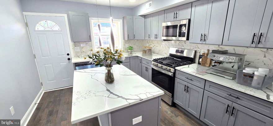 Greektown's best rehab!  The value is in the details.  Spectacular home, impeccably renovated.   Property was stripped down to the joists before work was done.  Entire interior was redone.  New plumbing, electrical, heating, and air conditioning systems.  New windows and doors.  Beautiful kitchen with granite counters, island, microwave, dishwasher, 5-burner gas stove, side-by-side refrigerator/freezer with water and ice on the door.  Upstairs bath has double sink, ceramic floor and bathtub surround.  Lower level bath has ceramic tile floor and shower surround.  Real wood floors on first and second levels.  Lower level has 3rd bedroom, laundry room, exit to rear.    Recessed lighting is most of the house.  Entire unit meticulously painted.  Rear fence could be modified to allow for parking.  Location at end of street allows for better parking than normally found in the area.